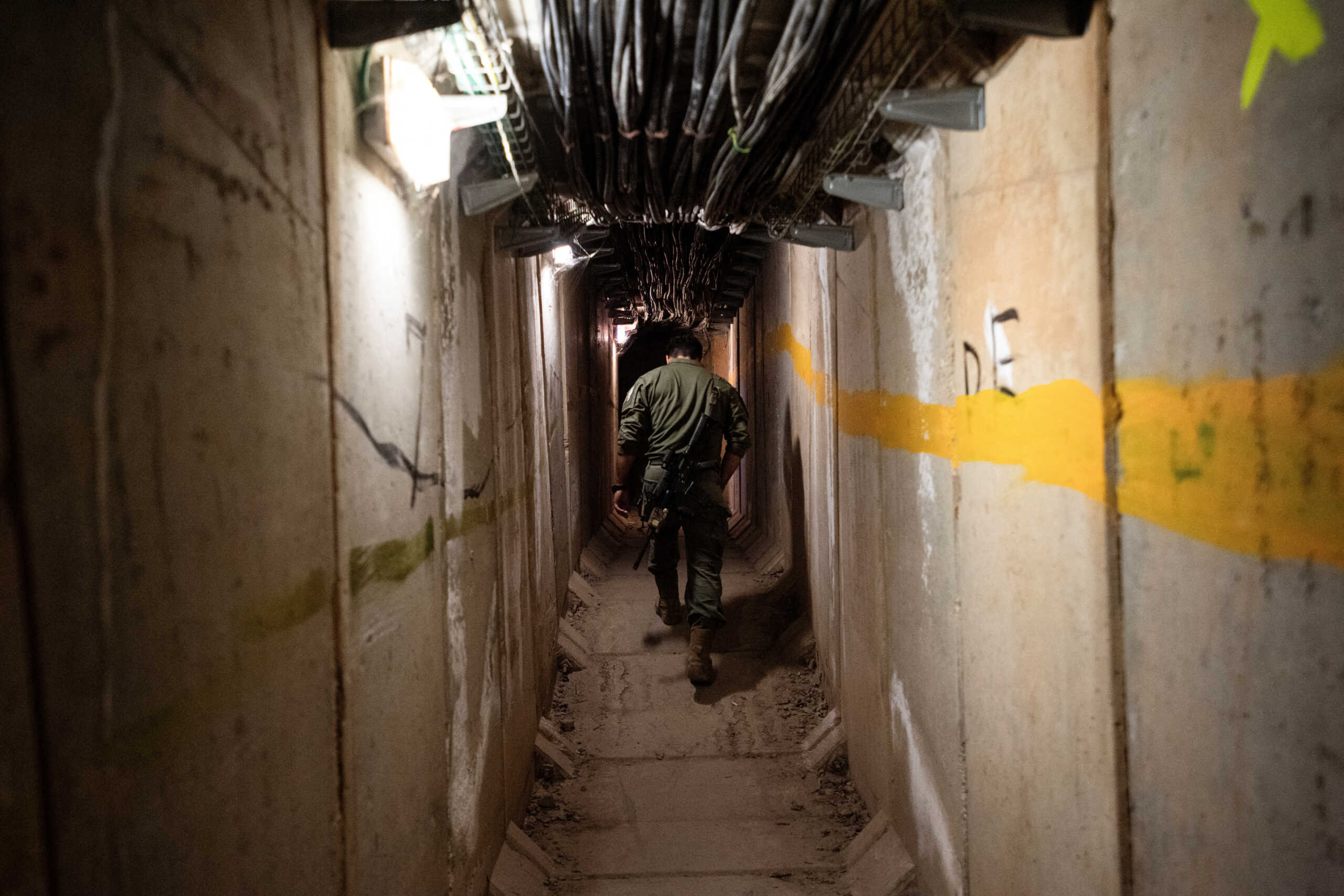 An Israeli soldier walks through a passageway in an underground location in an army base, amid cross-border hostilities between Hezbollah and Israel, near Israel's border with Lebanon in northern Israel, October 7, 2024. REUTERS