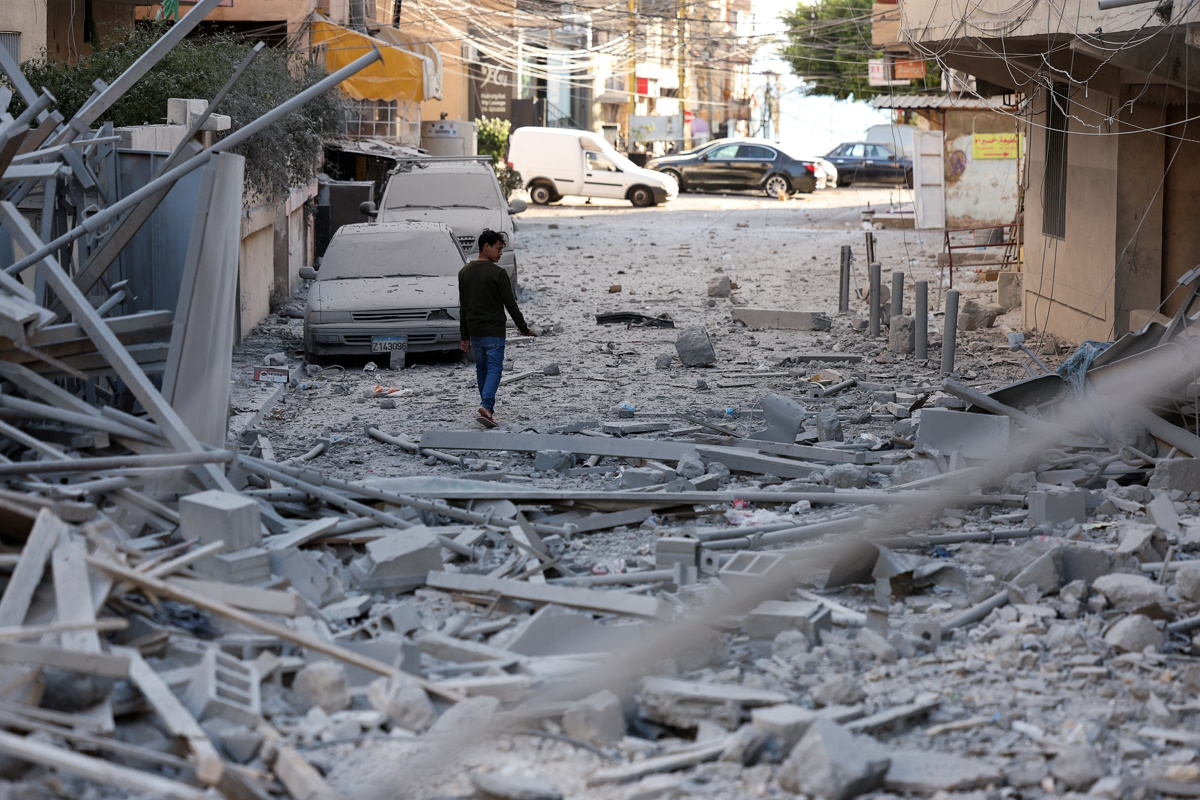 A person inspects the damage, following Israeli strikes, amid the ongoing hostilities between Hezbollah and Israeli forces, in Tyre, southern Lebanon, October 23, 2024. REUTERS