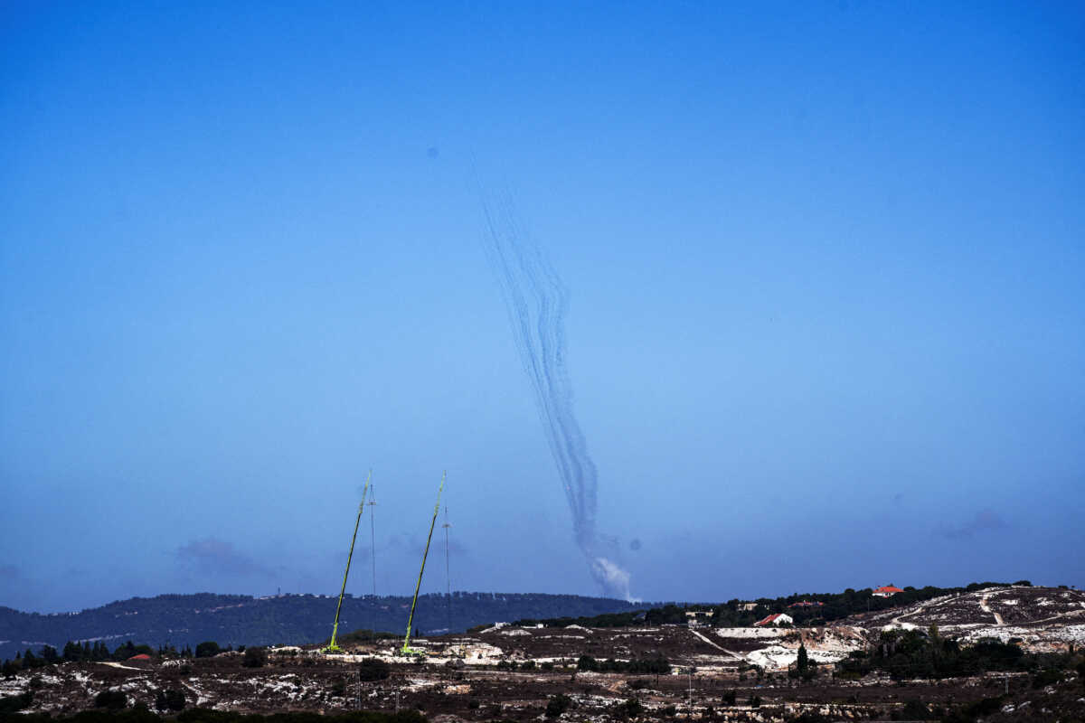 Rockets are launched from Lebanon towards Israel, amid cross-border hostilities between Hezbollah and Israel, as seen from northern Israel, October 8, 2024. REUTERS