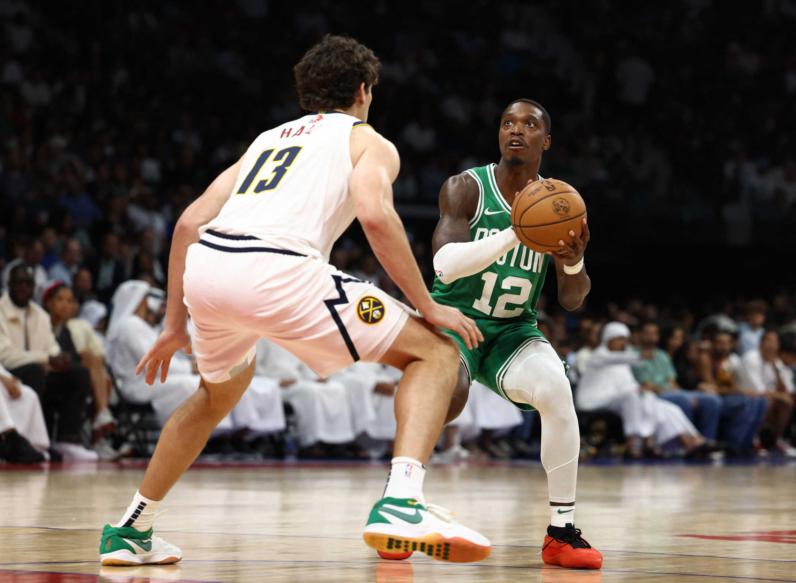 Basketball - NBA - Pre-Season Game - Boston Celtics v Denver Nuggets - Etihad Arena, Yas Island, Abu Dhabi, United Arab Emirates - October 6, 2024 Denver Nuggets' Drew Peterson in action with Boston Celtics' Lonnie Walker IV REUTERS