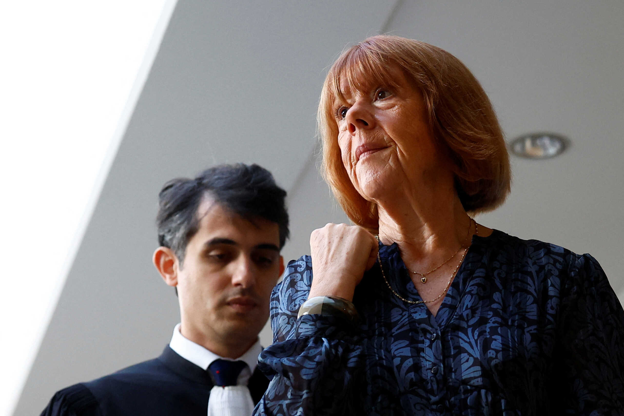 Gisele Pelicot, who has allegedly been drugged and raped by men solicited by her husband Dominique Pelicot at their home in the southern French town of Mazan, and her lawyer Stephane Babonneau attend the trial of her husband with 50 co-accused, at the courthouse in Avignon, France, October 23, 2024. REUTERS