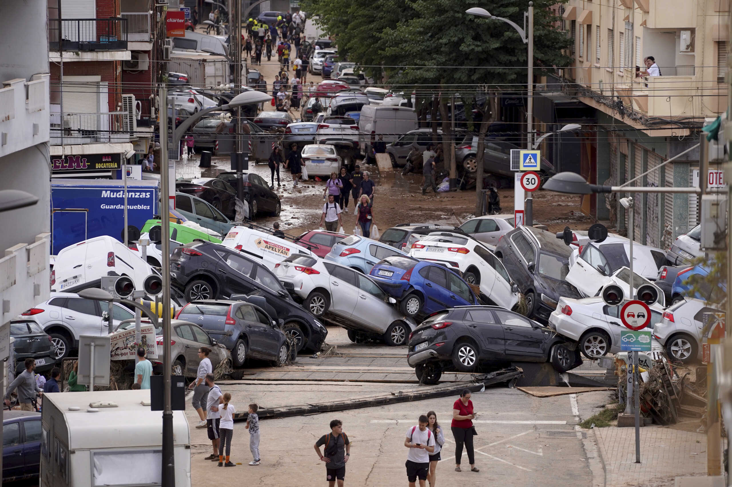 Vehicles are seen piled up after being swept away by floods in Valencia, Spain, Thursday, Oct. 31, 2024. (AP Photo