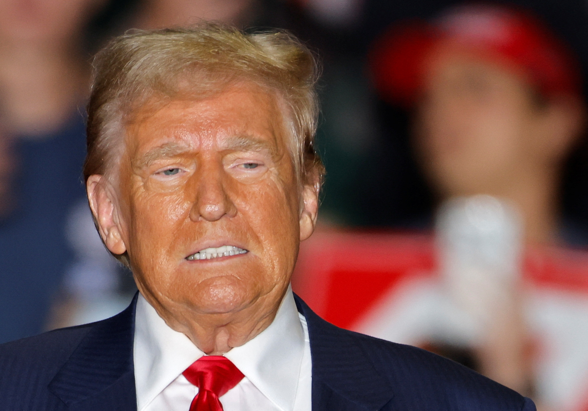 Republican presidential nominee former U.S. President Donald Trump  reacts during a rally in Greensboro Coliseum, in Greensboro, North Carolina, U.S. October 22, 2024. REUTERS