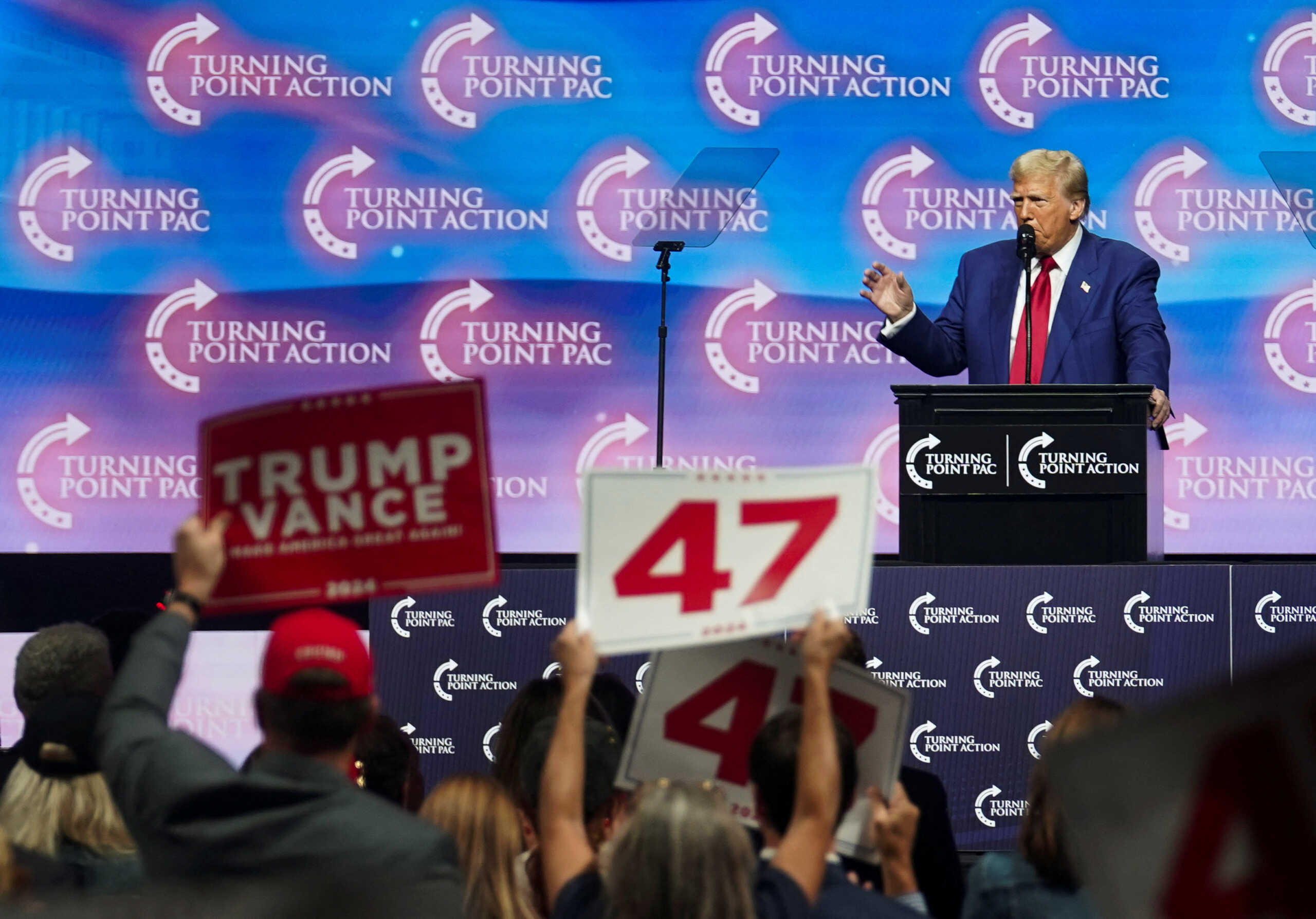 Republican presidential nominee and former U.S. President Donald Trump speaks during a campaign event sponsored by conservative group Turning Point USA, in Duluth, Georgia, U.S., October 23, 2024. REUTERS