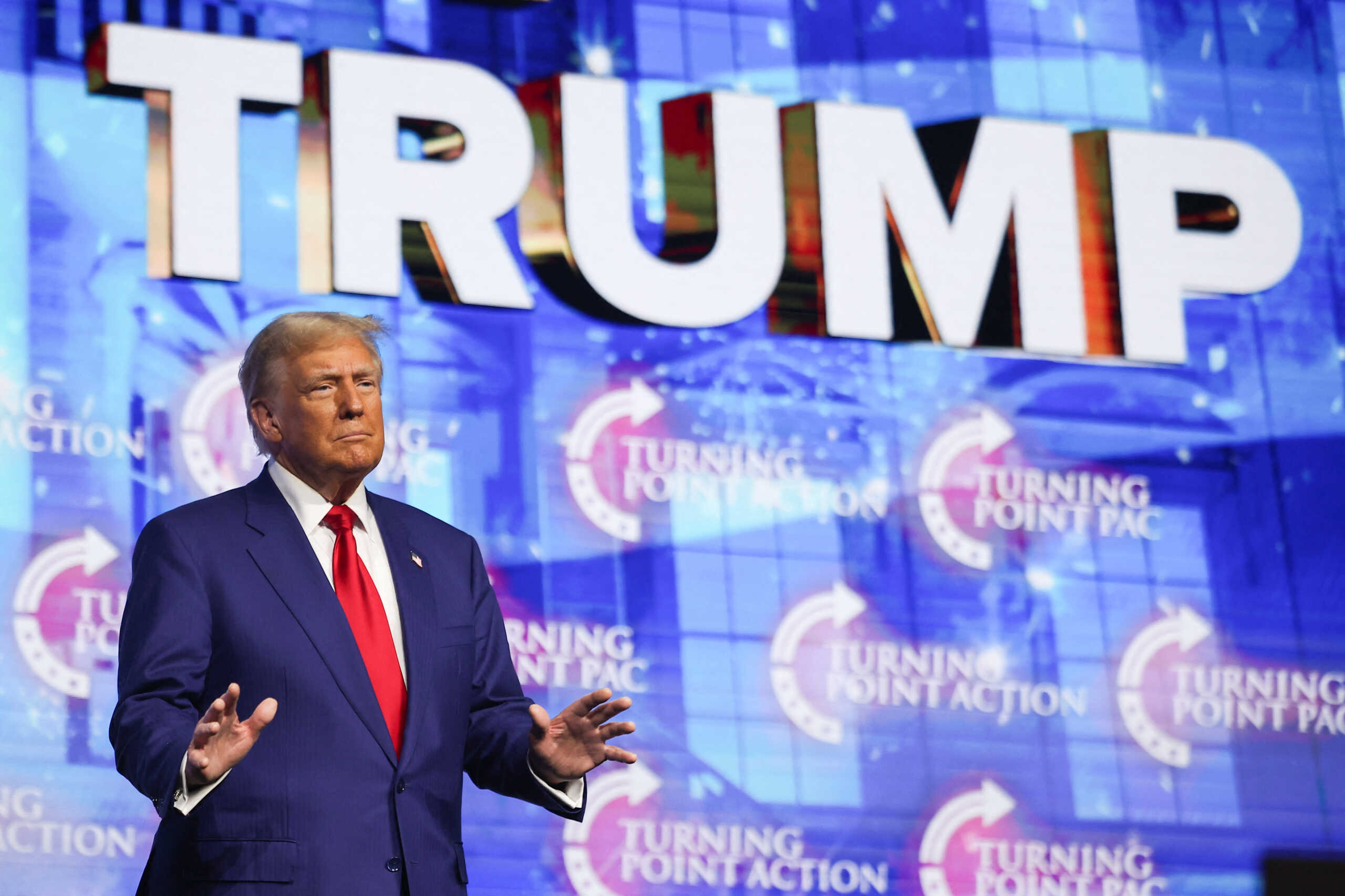 Republican presidential nominee and former U.S. President Donald Trump gestures during a campaign event sponsored by conservative group Turning Point USA, in Duluth, Georgia, U.S., October 23, 2024. REUTERS