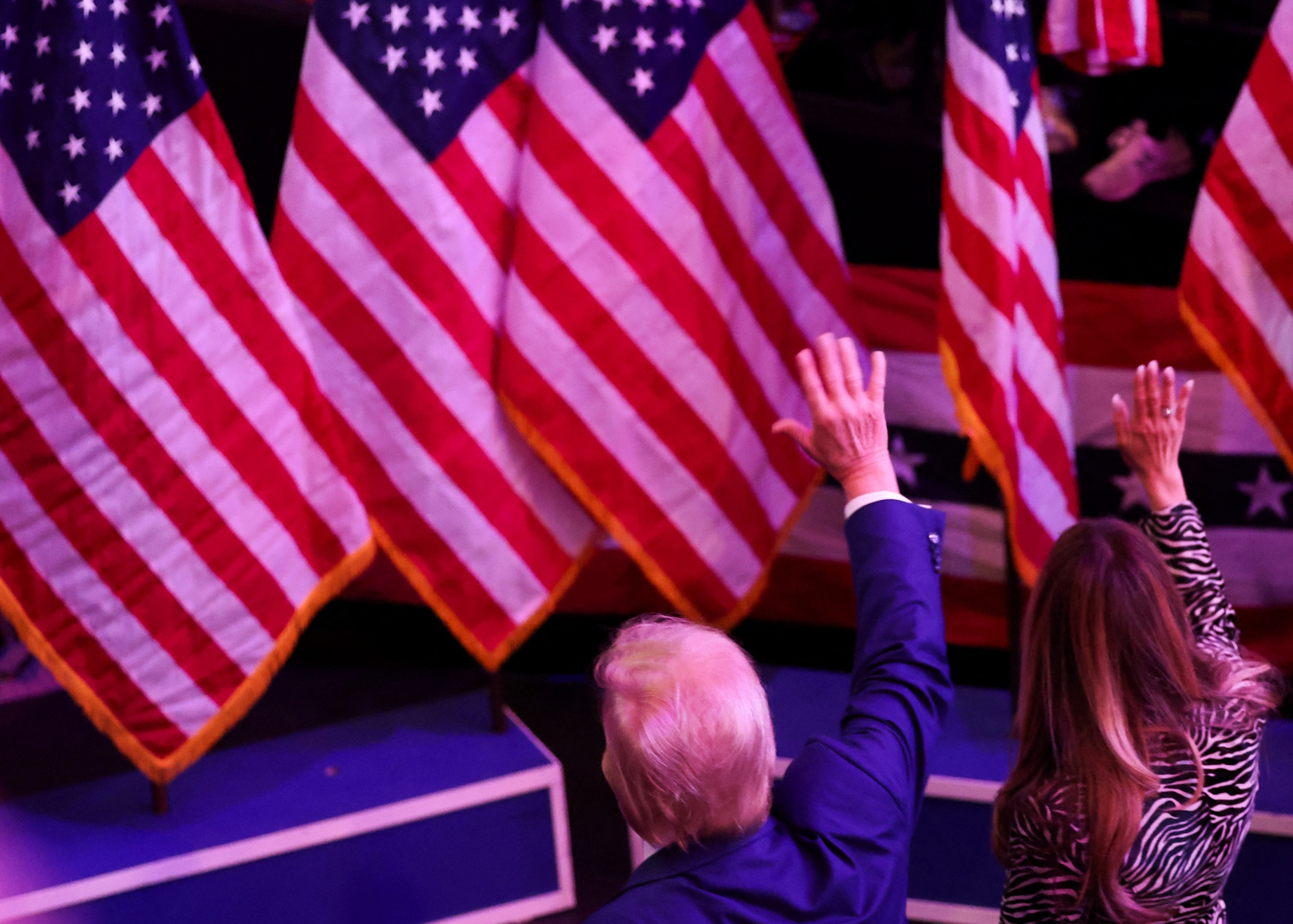 Republican presidential nominee and former U.S. President Donald Trump and Melania Trump wave during a campaign rally at Madison Square Garden, in New York, U.S., October 27, 2024. REUTERS