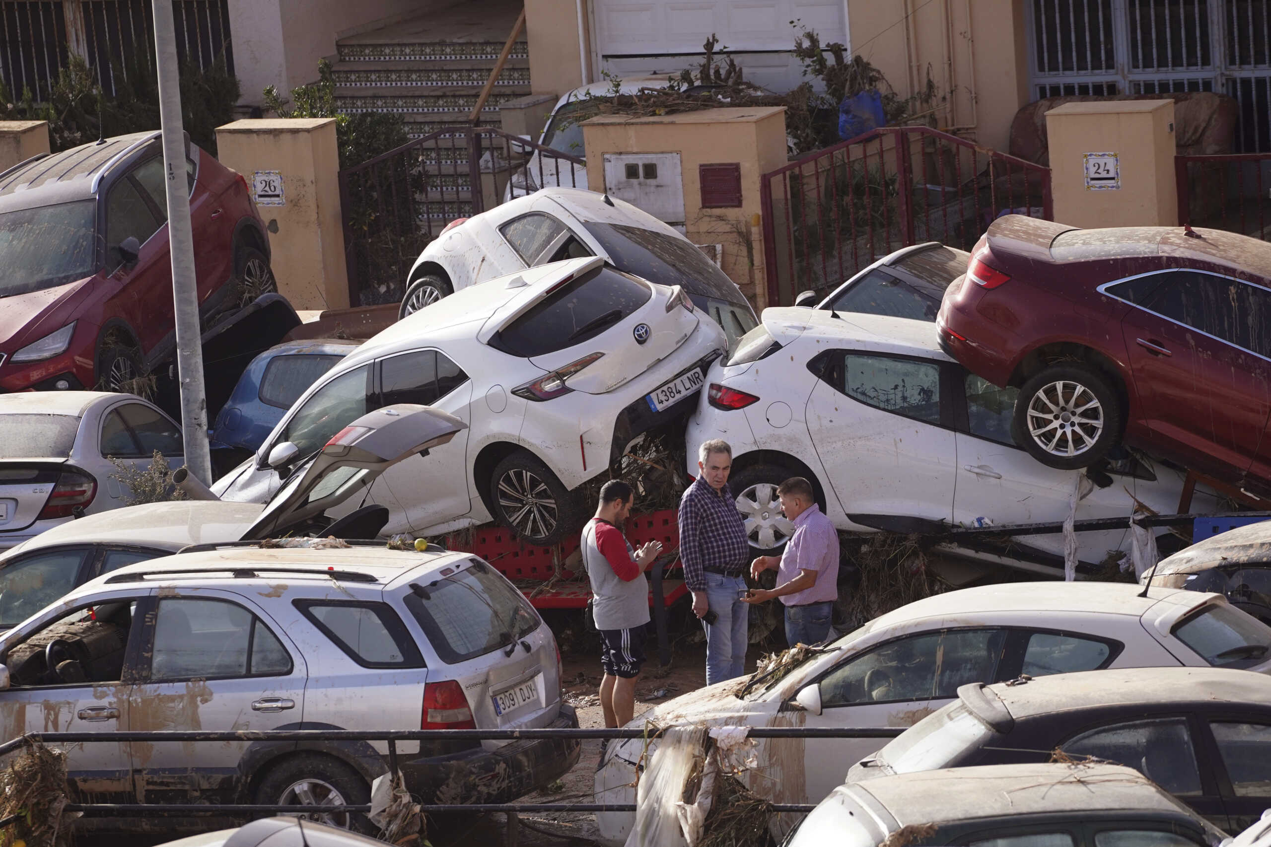 Vehicles are seen piled up after being swept away by floods in Valencia, Spain, Thursday, Oct. 31, 2024. (AP Photo
