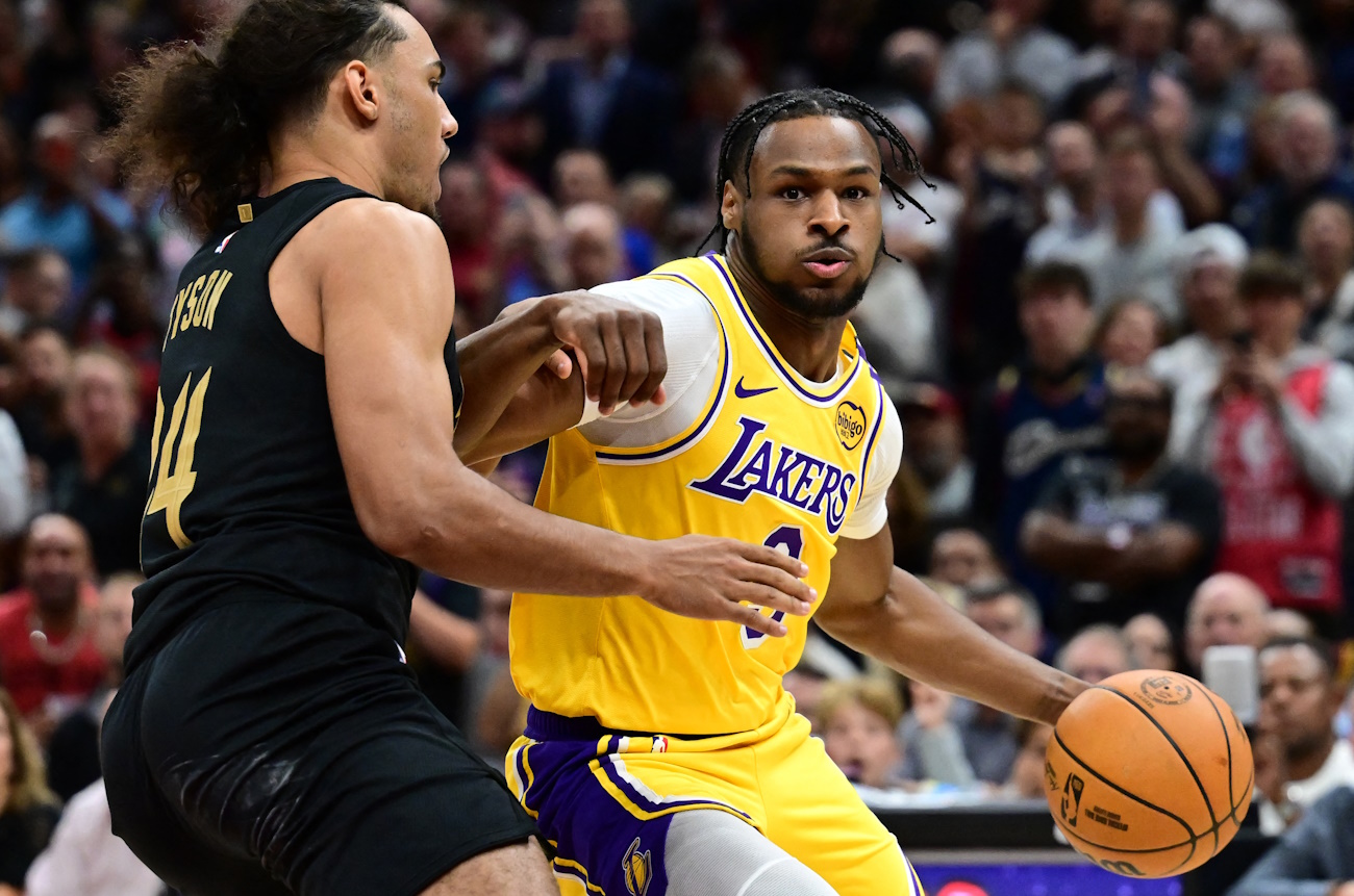 Oct 30, 2024; Cleveland, Ohio, USA; Los Angeles Lakers guard Bronny James (9) drives to the basket against Cleveland Cavaliers forward Jaylon Tyson (24) during the second half at Rocket Mortgage FieldHouse. Mandatory Credit: Ken Blaze-Imagn Images