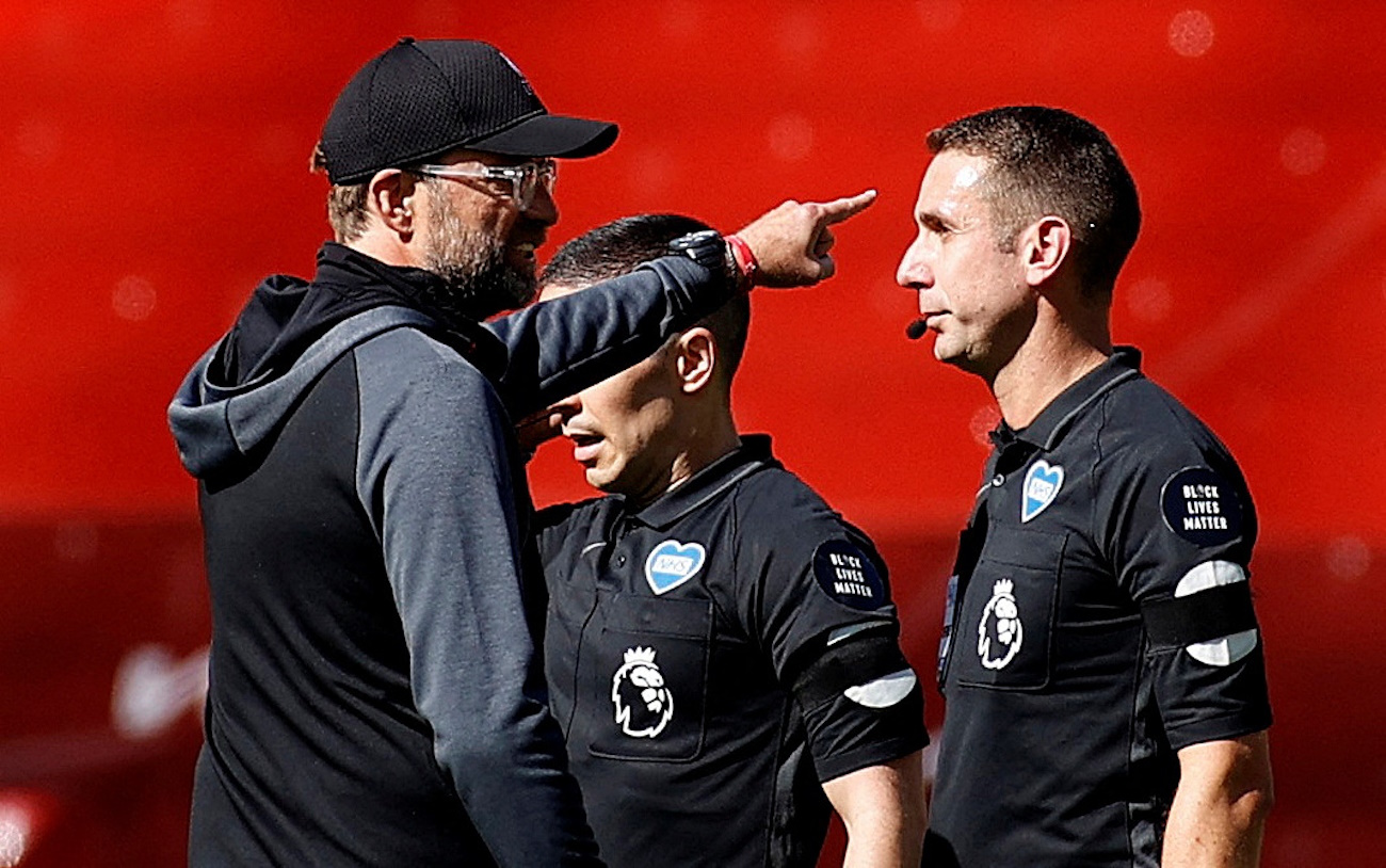 FILE PHOTO: Soccer Football - Premier League - Liverpool v Burnley - Anfield, Liverpool, Britain - July 11, 2020  Liverpool manager Juergen Klopp speaks with referee David Coote after the match, as play resumes behind closed doors following the outbreak of the coronavirus disease (COVID-19) Pool via REUTERS