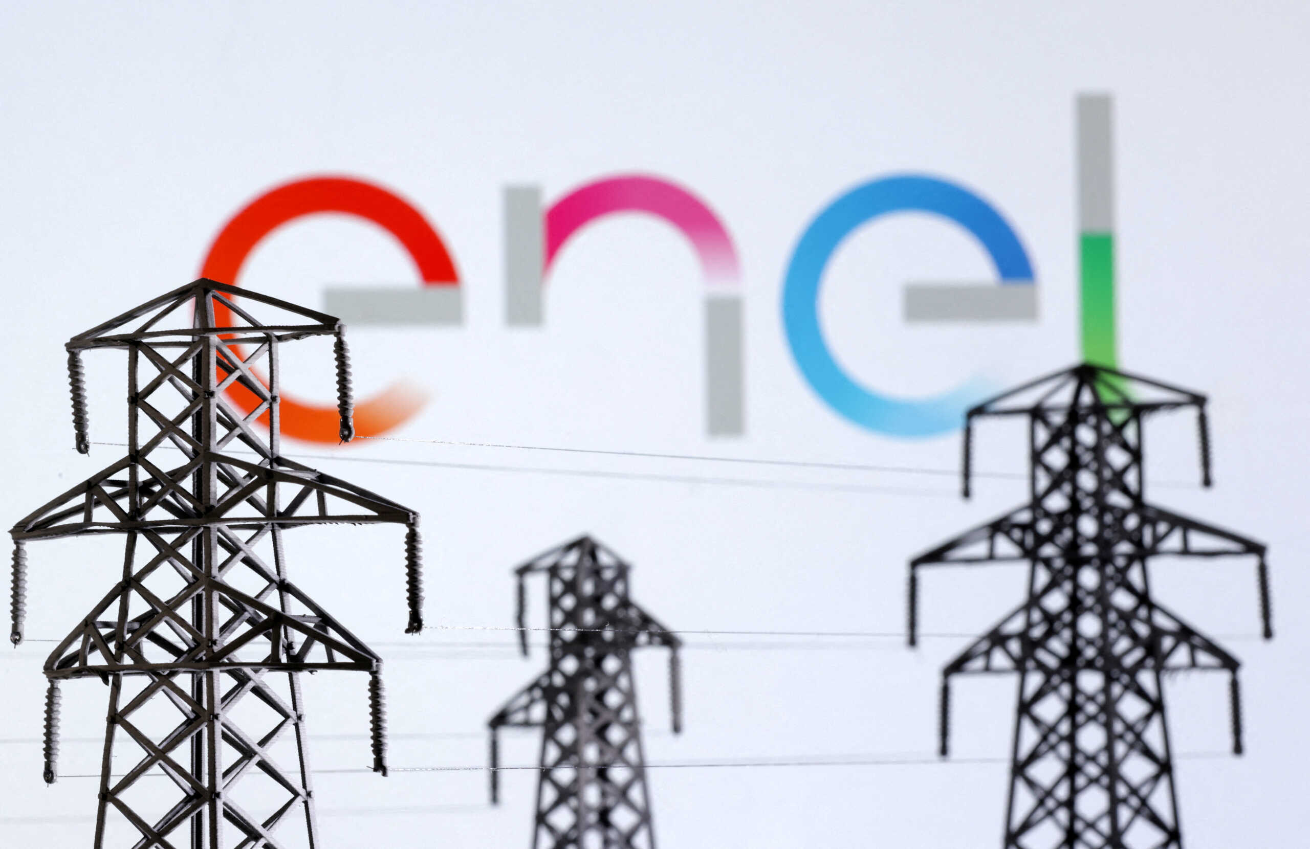 FILE PHOTO: Electric power transmission pylon miniatures and Enel logo are seen in this illustration taken, December 9, 2022. REUTERS