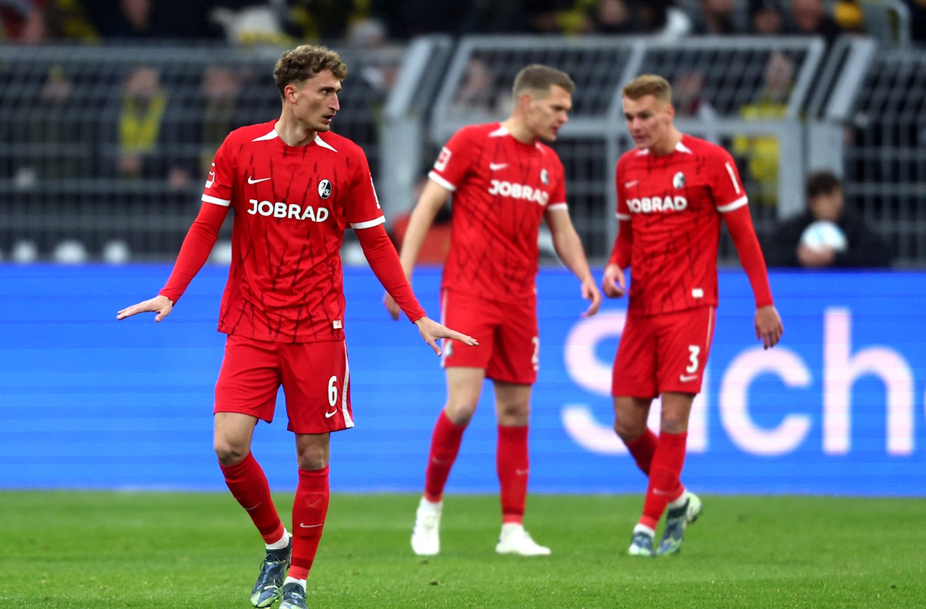 Soccer Football - Bundesliga - Borussia Dortmund v SC Freiburg - Signal Iduna Park, Dortmund, Germany - November 23, 2024 SC Freiburg's Patrick Osterhage reacts after Maximilian Beier scored Borussia Dortmund's first goal REUTERS