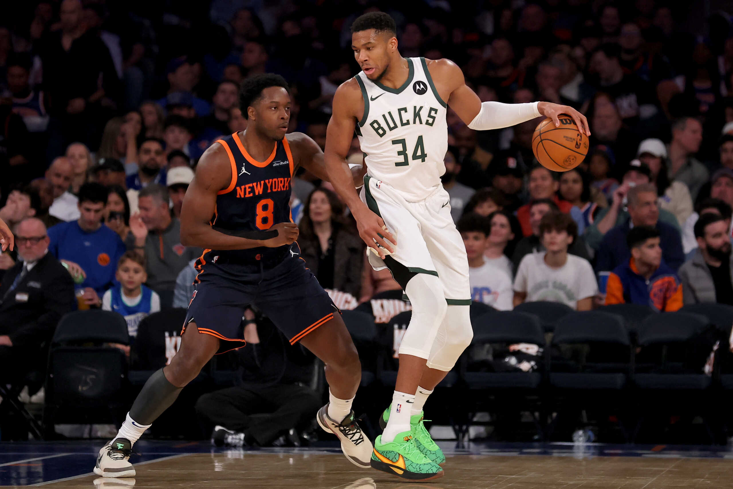 Nov 8, 2024; New York, New York, USA; Milwaukee Bucks forward Giannis Antetokounmpo (34) controls the ball against New York Knicks forward OG Anunoby (8) during the third quarter at Madison Square Garden. Mandatory Credit: Brad Penner-Imagn Images