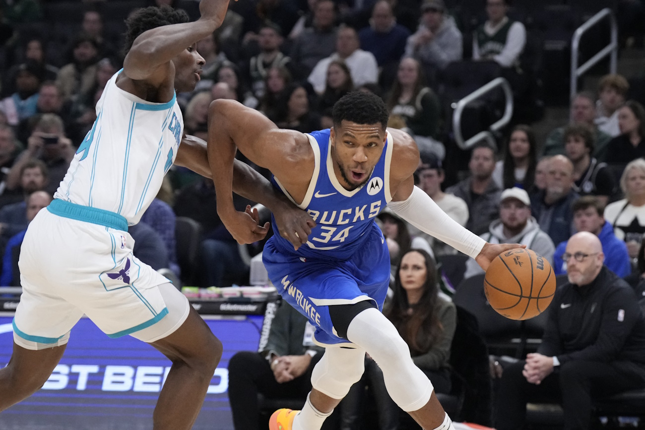 Nov 23, 2024; Milwaukee, Wisconsin, USA;  Milwaukee Bucks forward Giannis Antetokounmpo (34) drives to the basket against Charlotte Hornets forward Moussa Diabate (14) in the first half at Fiserv Forum. Mandatory Credit: Michael McLoone-Imagn Images