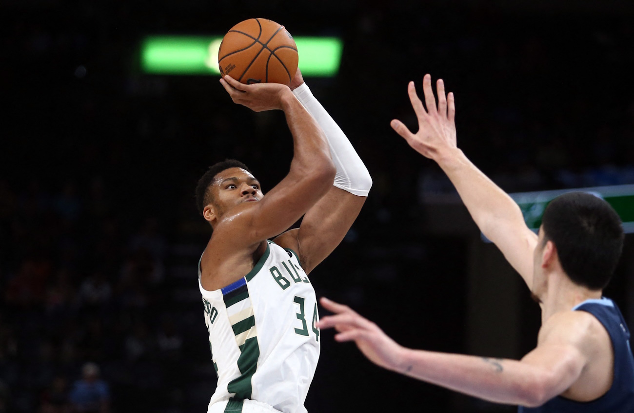 Oct 31, 2024; Memphis, Tennessee, USA; Milwaukee Bucks forward Giannis Antetokounmpo (34) shoots as Memphis Grizzlies center Zach Edey (14) defends during the first half at FedExForum. Mandatory Credit: Petre Thomas-Imagn Images