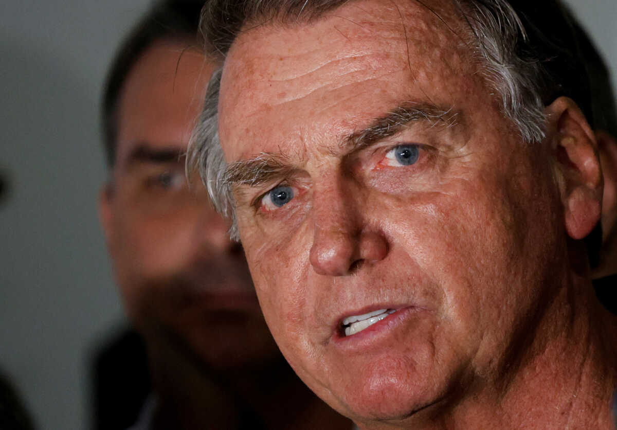 Brazil's former President Jair Bolsonaro talks with media upon his arrival at Brasilia International Airport, in Brasilia, Brazil November 25, 2024. REUTERS