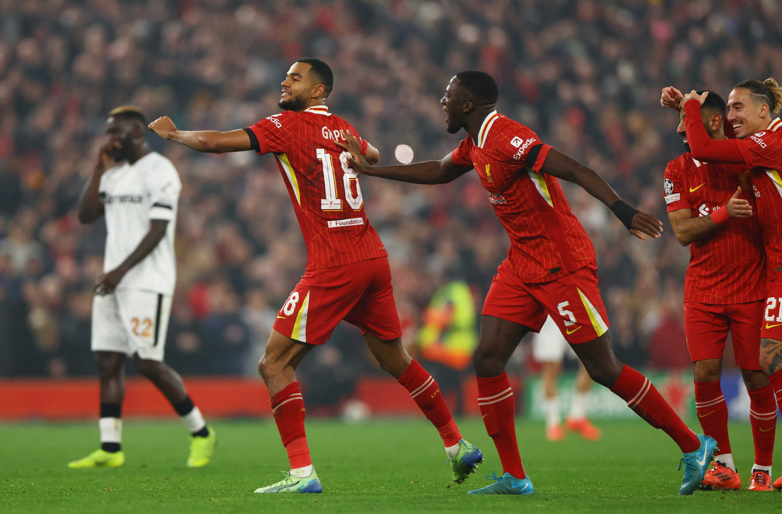 Soccer Football - Champions League - Liverpool v Bayer Leverkusen - Anfield, Liverpool, Britain - November 5, 2024 Liverpool's Cody Gakpo celebrates scoring their second goal with Liverpool's Ibrahima Konate, Liverpool's Mohamed Salah and Liverpool's Kostas Tsimikas REUTERS