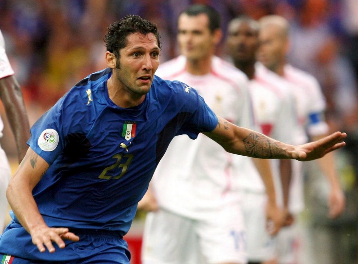 epa01094121 (FILE) A file photograph showing Marco Materazzi (C) from Italy celebrates after scoring the 1:1 equalizer during the final of the 2006 FIFA World Cup between Italy and France at the Olympic Stadium in Berlin, Germany, Sunday 09 July 2006.Italy's World Cup winning defender Marco Materazzi revealed 18 August 2007,  that he had told French icon Zinedine Zidane during last year's final that he preferred his 'whore of a sister' to his shirt. It was this comment that led to Zidane headbutting Materazzi in the chest and being dramatically sent off. That incident preceded France losing the final in a penalty shoot-out.  EPA