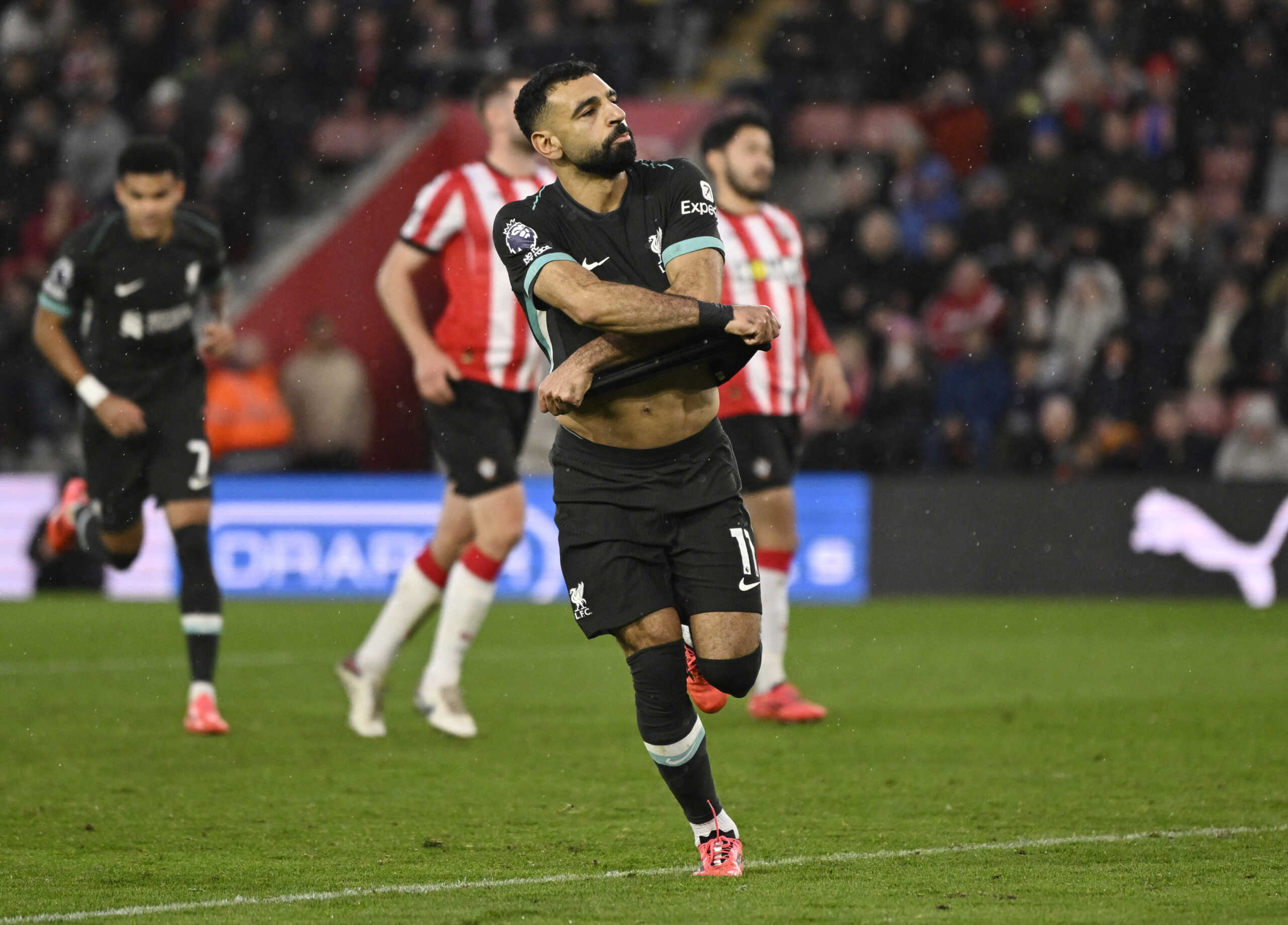 Soccer Football - Premier League - Southampton v Liverpool - St Mary's Stadium, Southampton, Britain - November 24, 2024  Liverpool's Mohamed Salah celebrates scoring their third goal REUTERS
