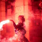 A demonstrator throws a flare during a protest over an accident at a railway station in the Serbian city of Novi Sad, for which they blame negligence and corruption by the authorities, in front of the city hall of Novi Sad, Serbia November 5, 2024. REUTERS