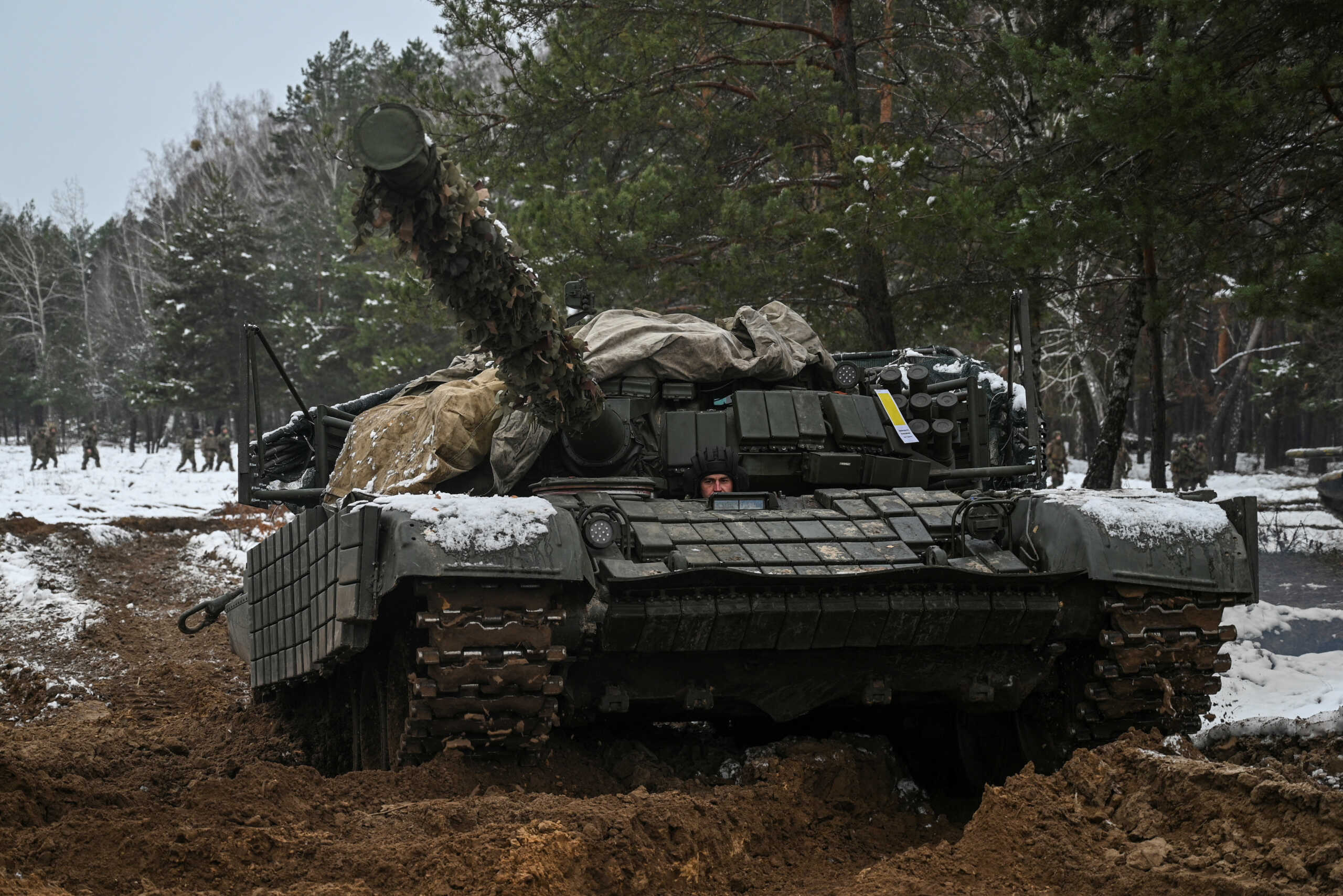 A Ukrainian service member drives a tank during military drills at a training ground, amid Russia's attack on Ukraine, in Chernihiv region, Ukraine, November 22, 2024. REUTERS