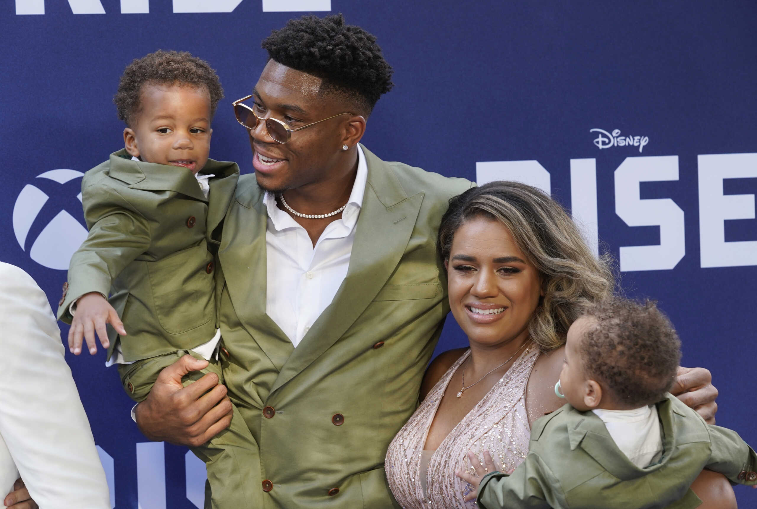 NBA basketball player Giannis Antetokounmpo and his wife Mariah pose with their sons Liam, left, and Maverick at the premiere of the Disney+ film "Rise," Wednesday, June 22, 2022, at Walt Disney Studios in Burbank, Calif. The film is based on the true story of Antetokounmpo and his family, who emigrated from Nigeria to Greece before Giannis and two of his brothers found success in the National Basketball Association. (AP Photo