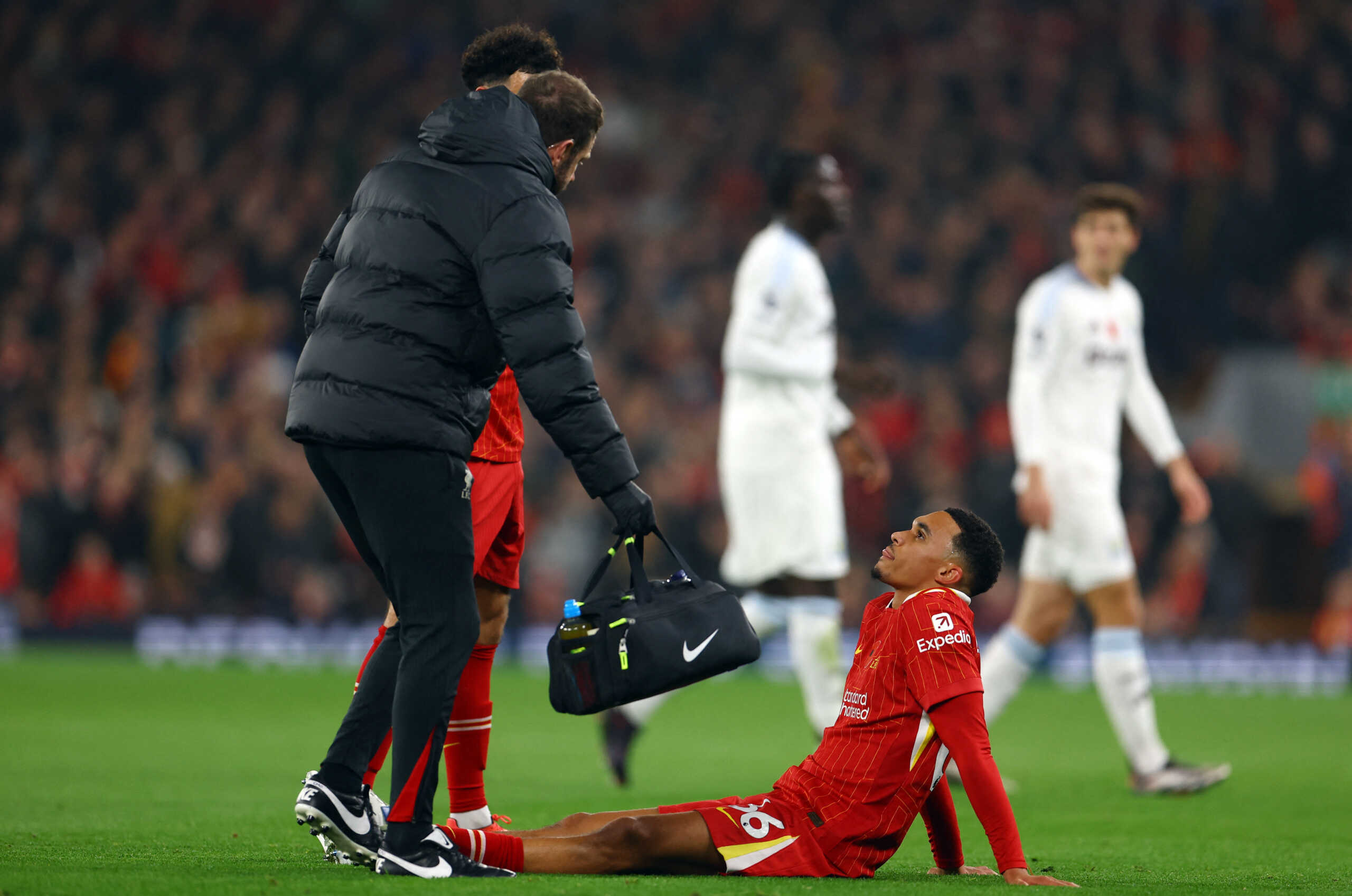Soccer Football - Premier League - Liverpool v Aston Villa - Anfield, Liverpool, Britain - November 9, 2024 Liverpool's Trent Alexander-Arnold receives medical attention after sustaining an injury REUTERS