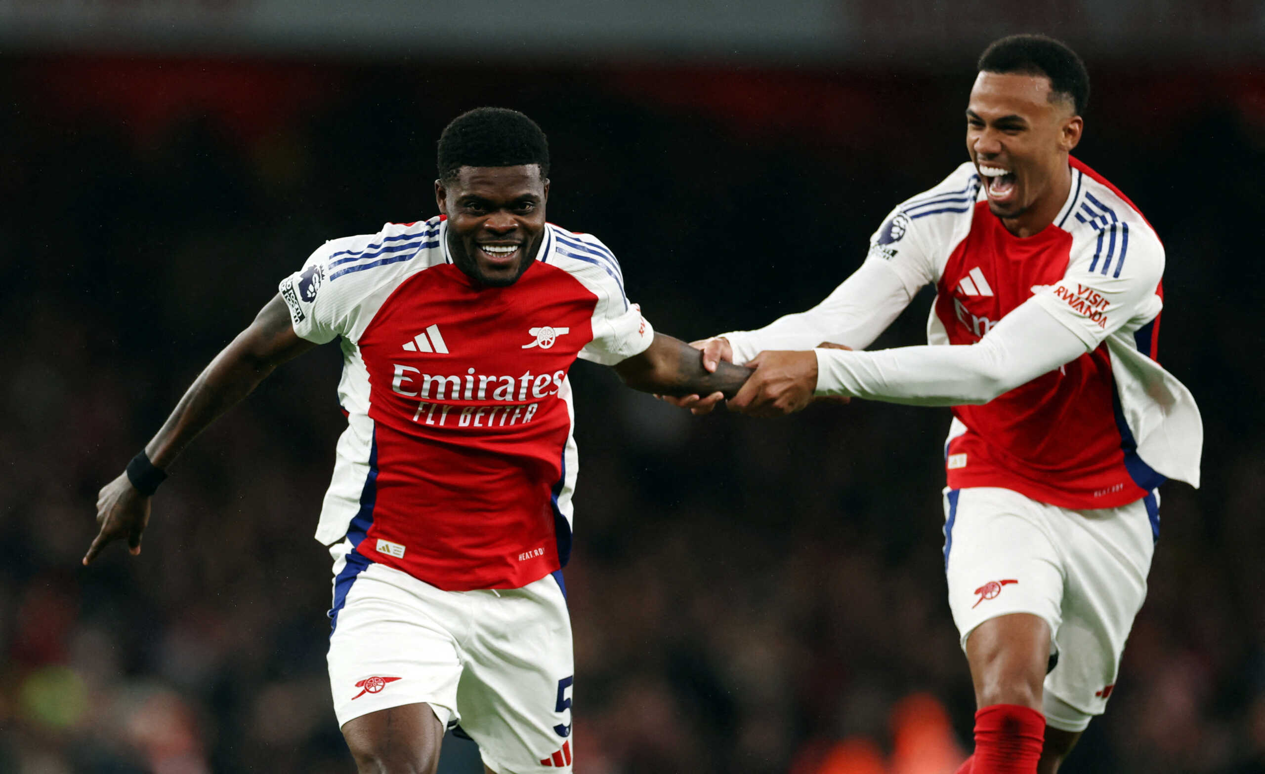 Soccer Football - Premier League - Arsenal v Nottingham Forest - Emirates Stadium, London, Britain - November 23, 2024 Arsenal's Thomas Partey celebrates scoring their second goal with Gabriel Magalhaes REUTERS