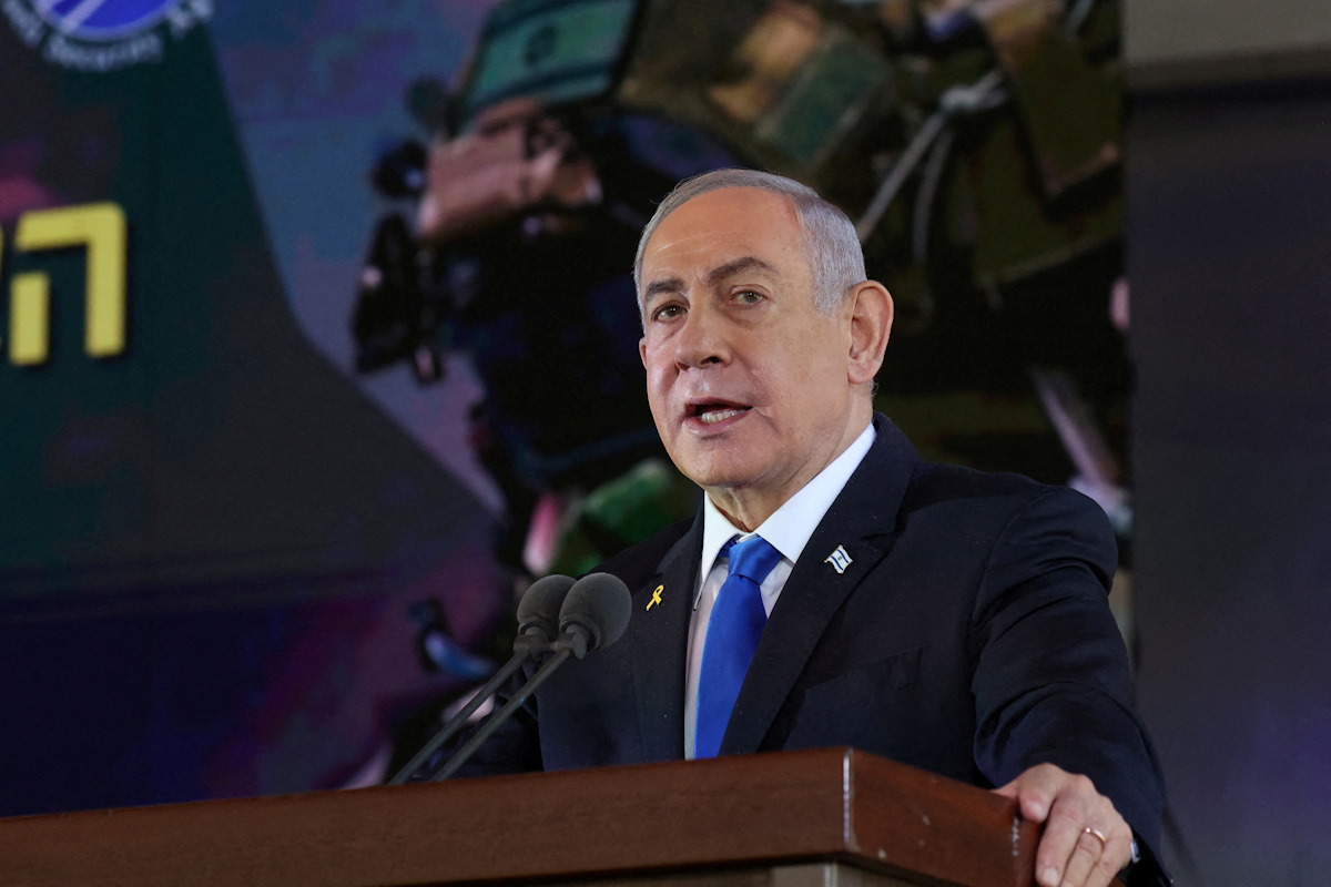 Israel's Prime Minister Benjamin Netanyahu delivers a speech during a memorial ceremony of the Hamas attack on October 7 last year that sparked the ongoing war in Gaza, at the Mount Herzl military cemetery in Jerusalem on October 27, 2024. GIL COHEN-MAGEN