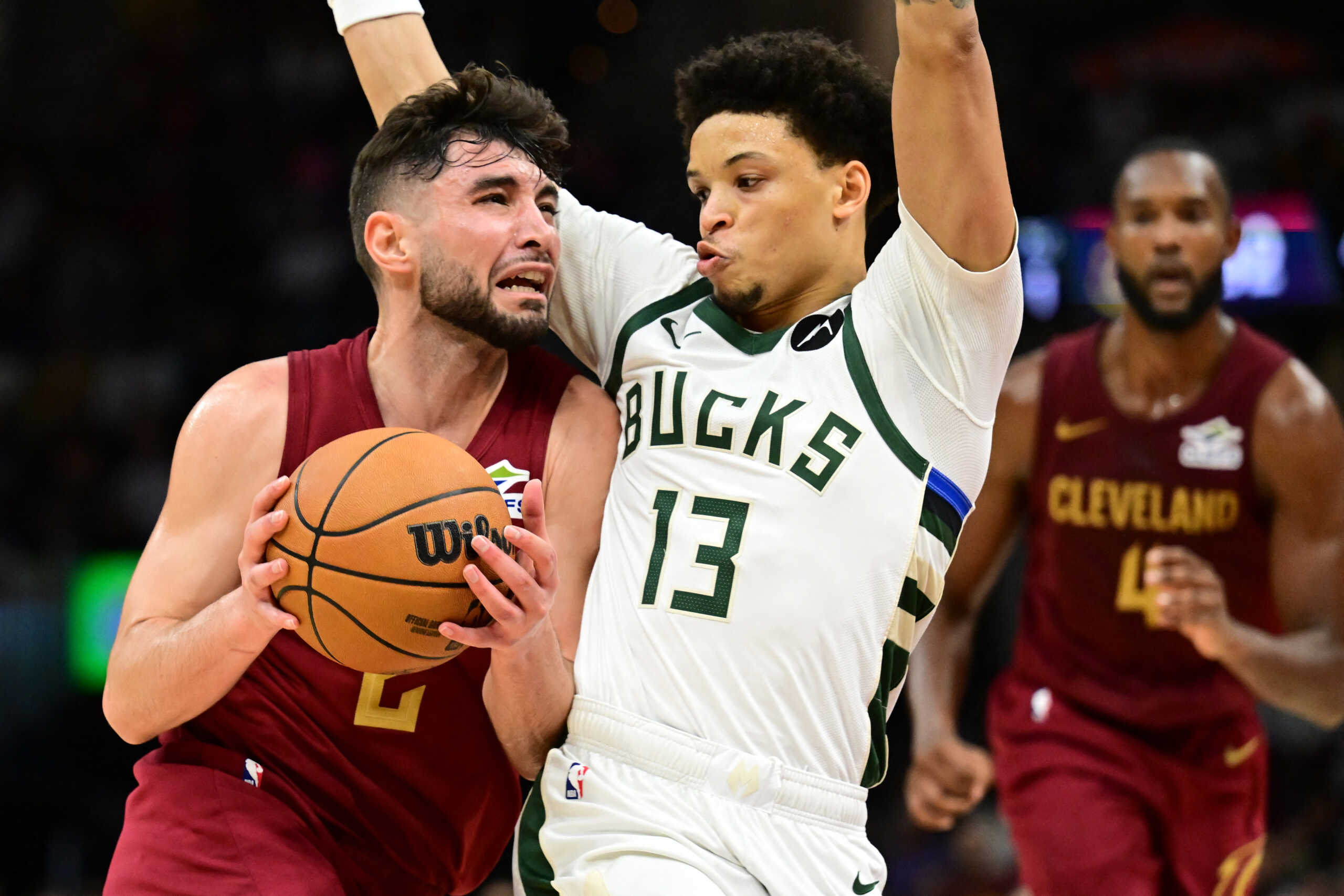 Nov 4, 2024; Cleveland, Ohio, USA; Cleveland Cavaliers guard Ty Jerome (2) drives to the basket against Milwaukee Bucks guard Ryan Rollins (13) during the second half at Rocket Mortgage FieldHouse. Mandatory Credit: Ken Blaze-Imagn Images