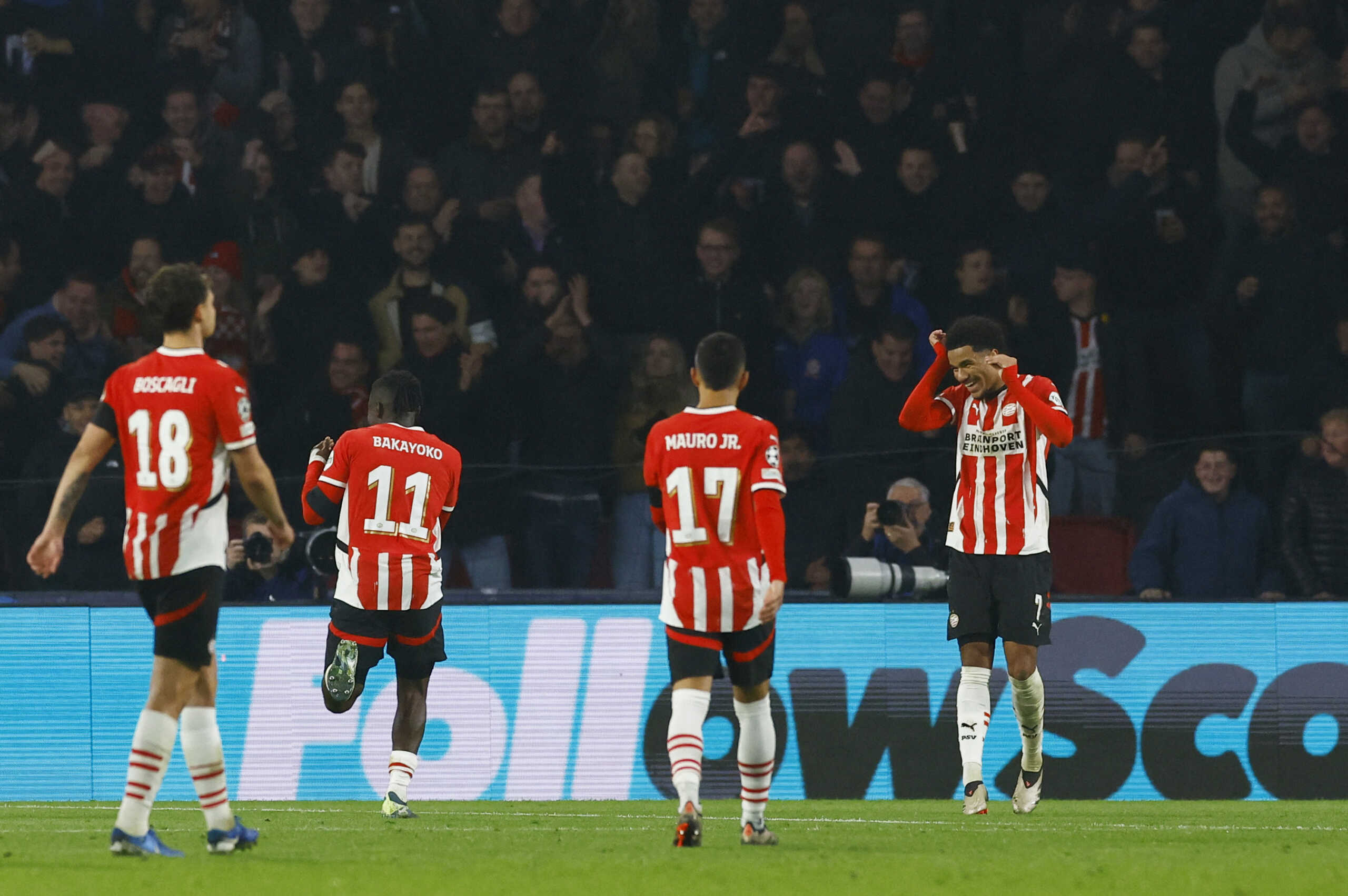 Soccer Football - Champions League - PSV Eindhoven v Girona - Philips Stadion, Eindhoven, Netherlands - November 5, 2024 PSV Eindhoven's Johan Bakayoko celebrates scoring their third goal with Malik Tillman REUTERS