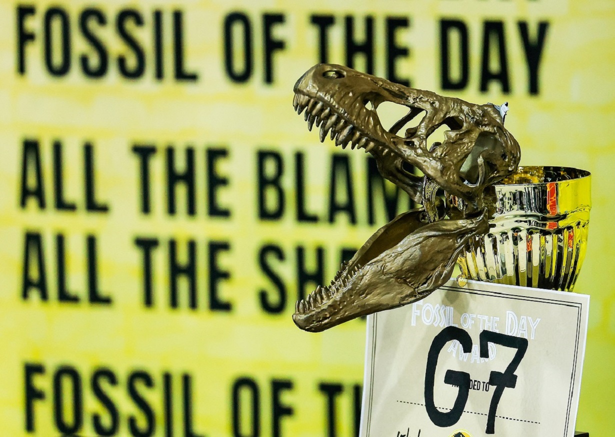 A dinosaur skull model is attached to a trophy cup during the "Fossil of The Day" action at the United Nations Climate Change Conference (COP29) in Baku, Azerbaijan November 15, 2024. REUTERS