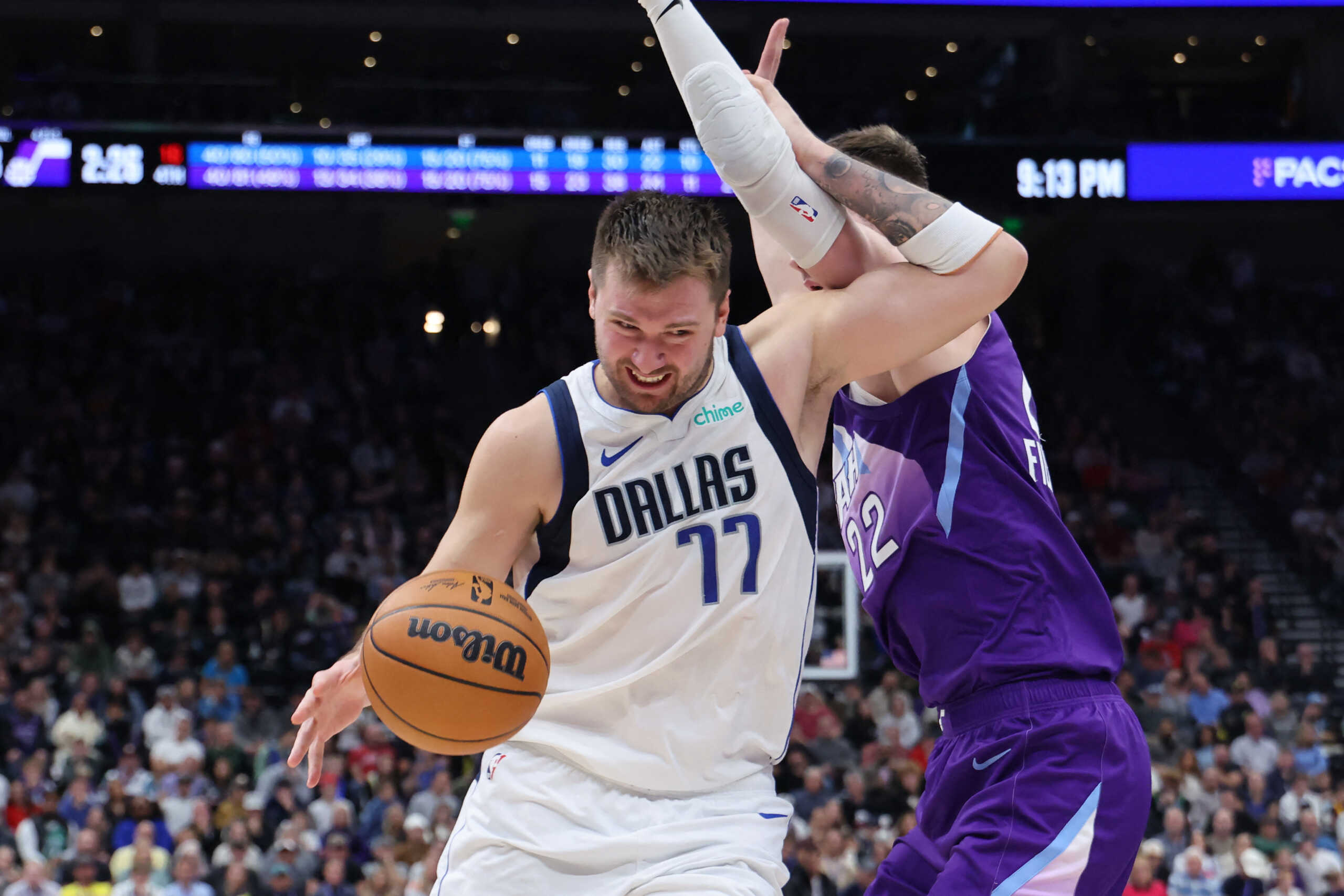 Nov 14, 2024; Salt Lake City, Utah, USA; Dallas Mavericks guard Luka Doncic (77) drives against Utah Jazz forward Kyle Filipowski (22) during the fourth quarter at Delta Center. Mandatory Credit: Rob Gray-Imagn Images
