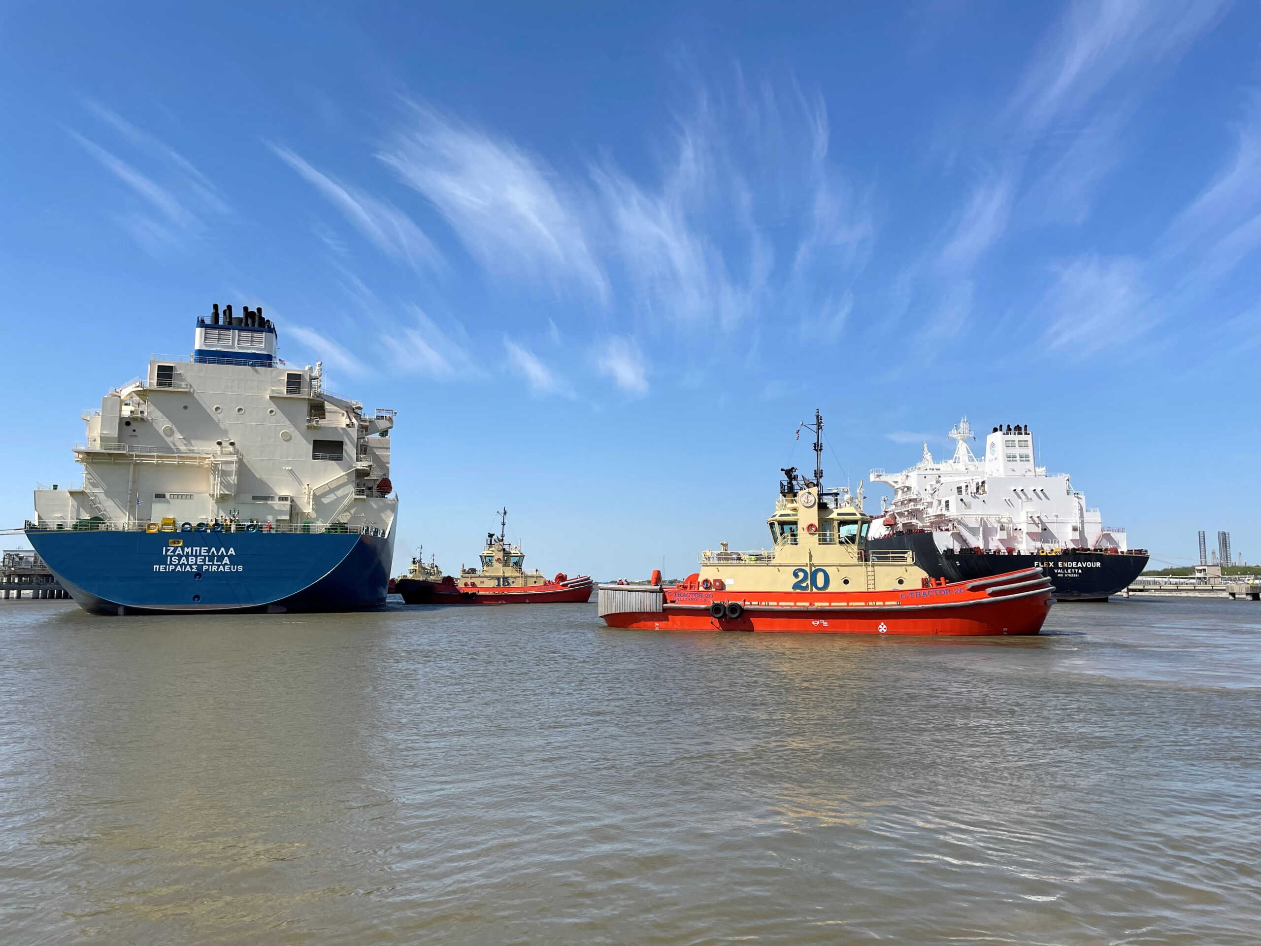 FILE PHOTO: An LNG tanker is guided by tug boats at the Cheniere Sabine Pass LNG export unit in Cameron Parish, Louisiana, U.S., April 14, 2022. REUTERS