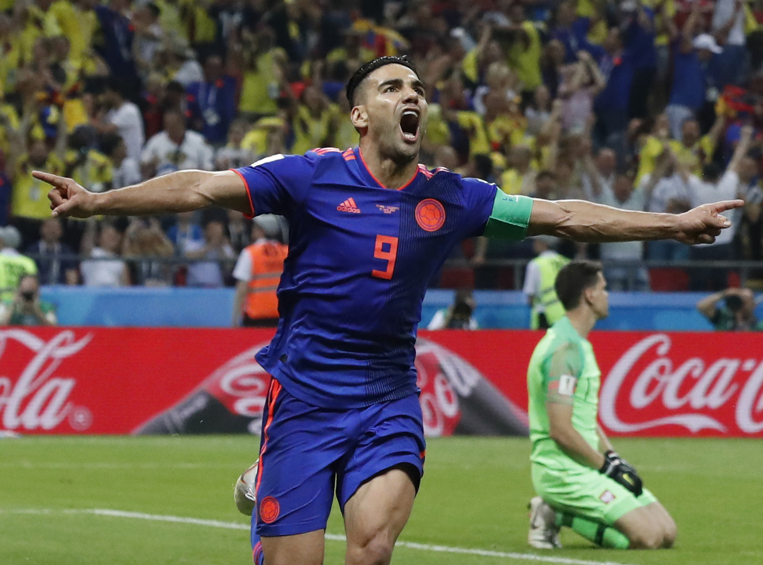 FILE - Colombia's Radamel Falcao celebrates after scoring against Poland goalkeeper Wojciech Szczesny during the group H match at the soccer World Cup at Kazan Arena in Kazan, Russia, June 24, 2018. After nearly 25 years away, Falcao is coming back home. The 38-year-old striker will play for Millonarios de Bogotá next season, the team announced Thursday, June 20, 2024. (AP Photo