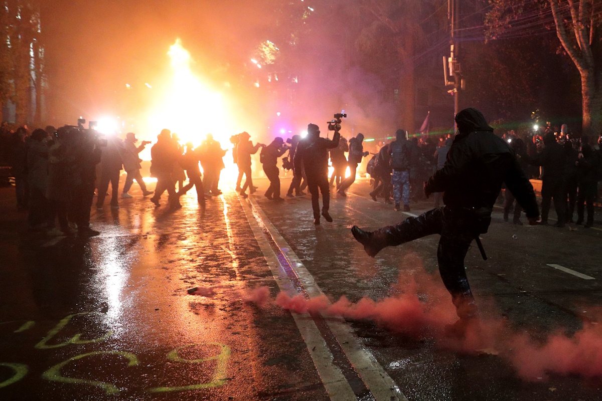 Supporters of Georgia's opposition attend a rally to protest after the government halted the EU application process until 2028, in front of the Parliament building in Tbilisi, Georgia, November 29, 2024. REUTERS