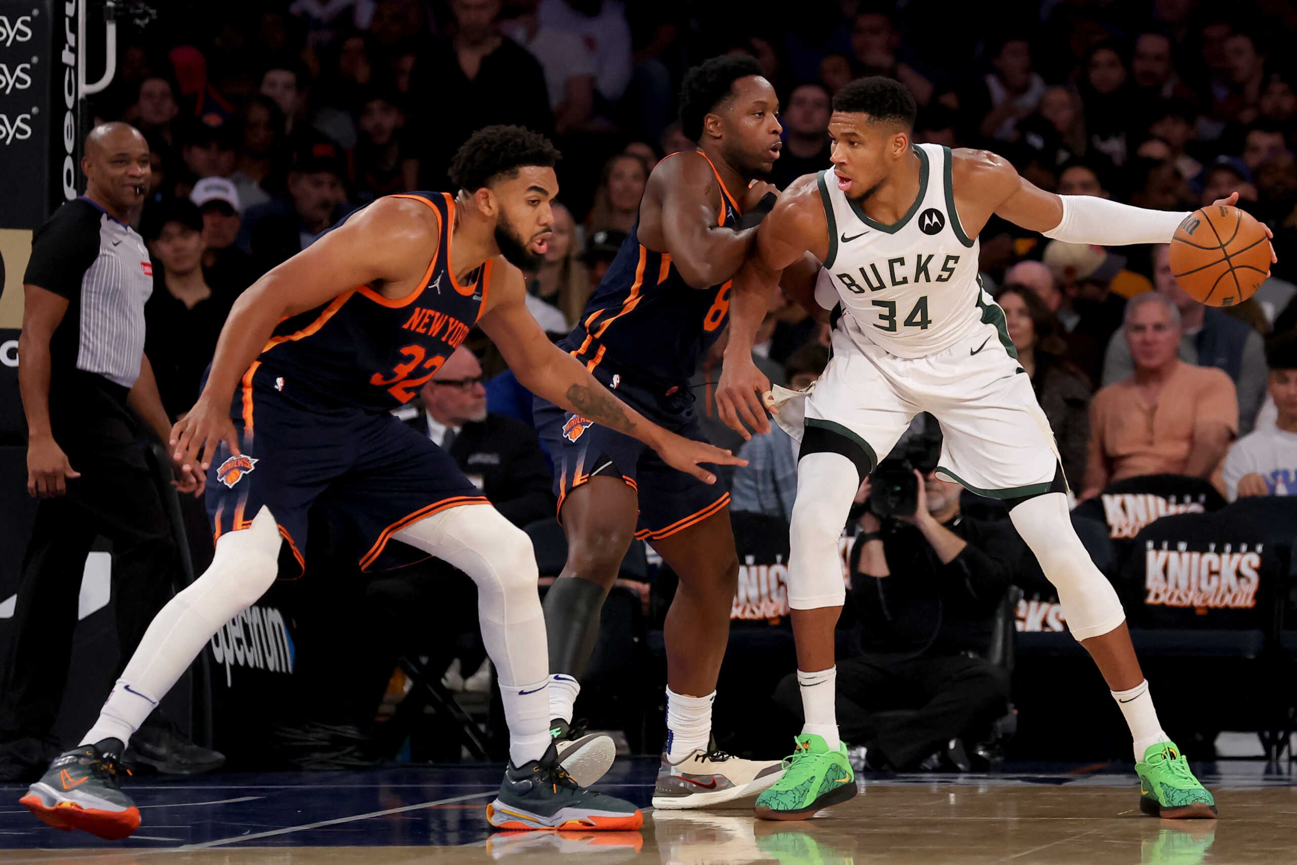 Nov 8, 2024; New York, New York, USA; Milwaukee Bucks forward Giannis Antetokounmpo (34) controls the ball against New York Knicks forward OG Anunoby (8) and center Karl-Anthony Towns (32) during the third quarter at Madison Square Garden. Mandatory Credit: Brad Penner-Imagn Images