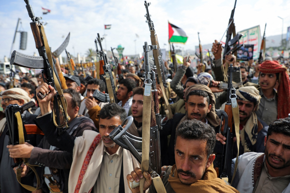 Protesters, mainly Houthi supporters, hold up weapons as they rally to show support to Palestinians and Lebanon's Hezbollah in Sanaa, Yemen November 8, 2024. REUTERS