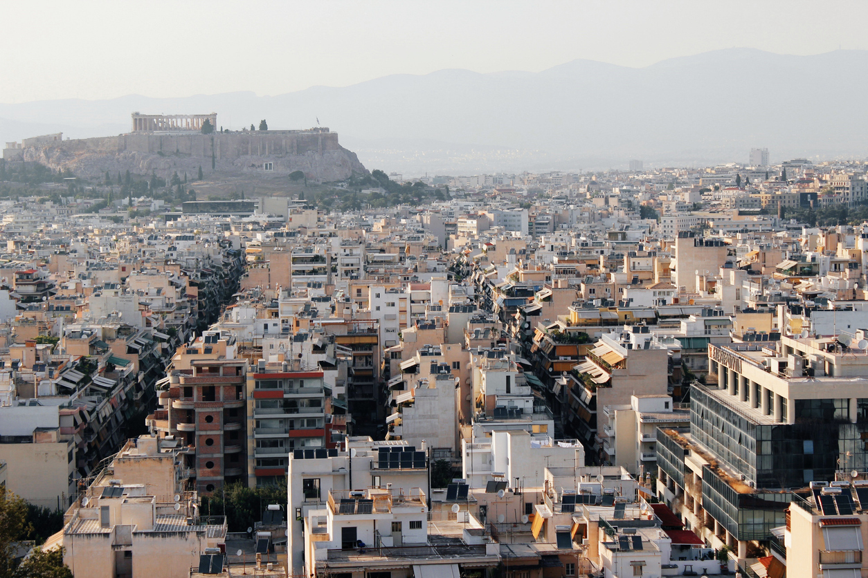 Partial view of Athens city with Acropolis hill in the background - Athens, Greece, June 13 2019.
