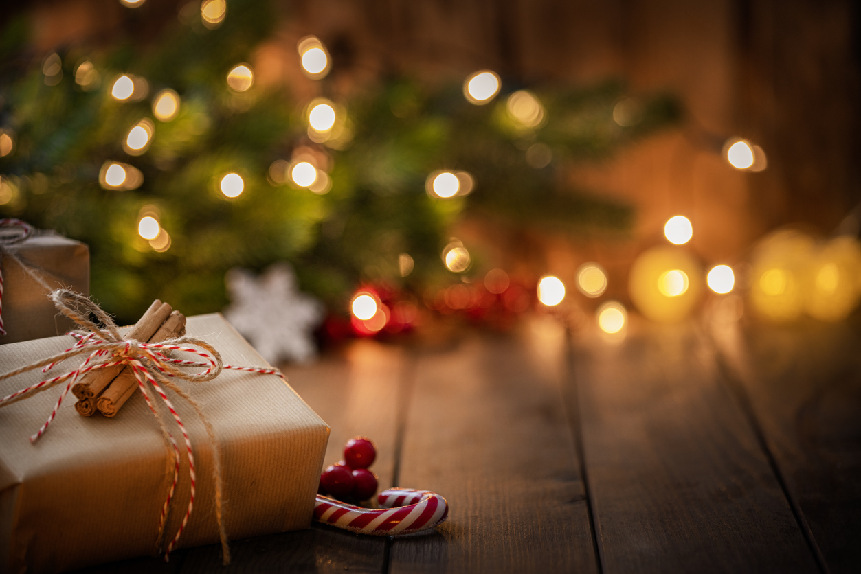 Brown Christmas gift box on rustic wooden table. High resolution 42Mp studio digital capture taken with Sony A7rII and Canon EF 70-200mm f