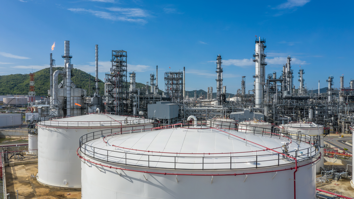 Oil and Gas refinery petrochemical plant industrial with oil and gas storage tank, White oil and gas refinery storage tank, Aerial view Oil and gas refinery plant from industry zone.