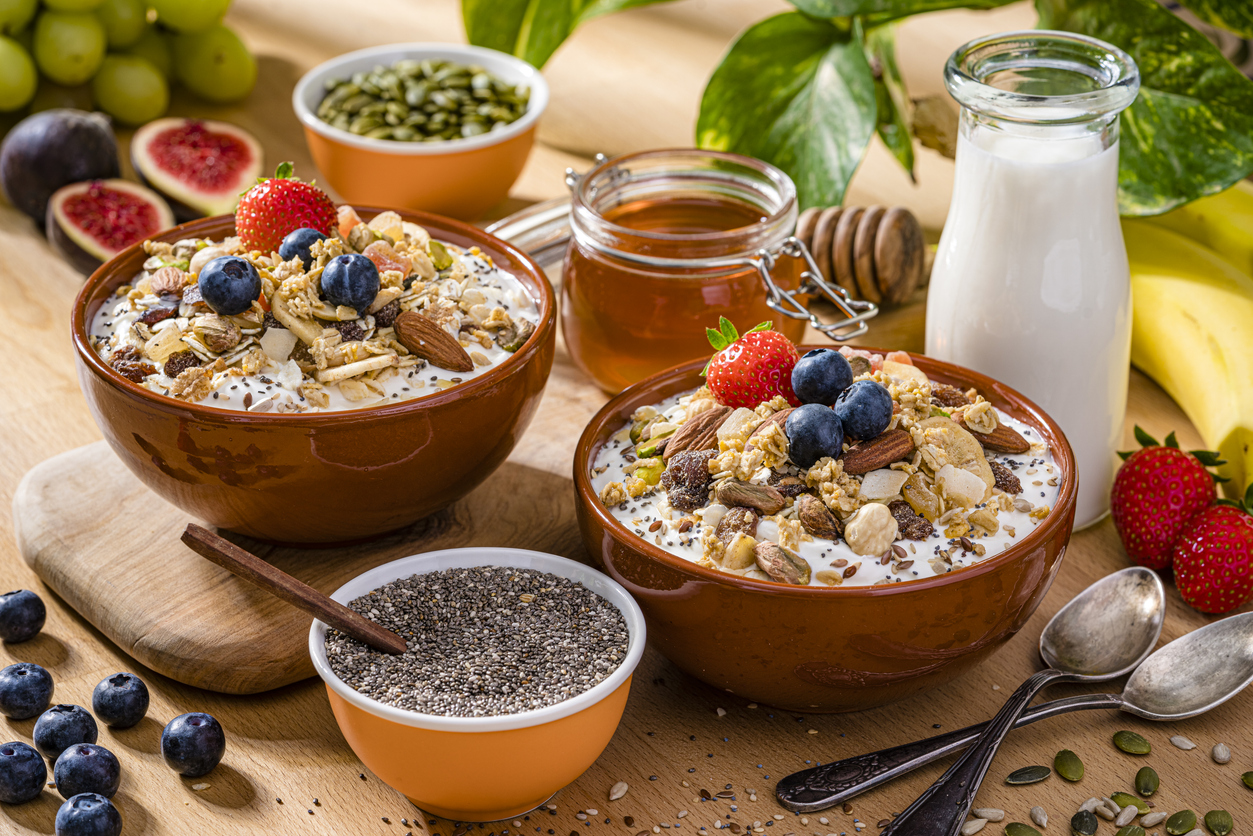 Two granola bowls on breakfast table