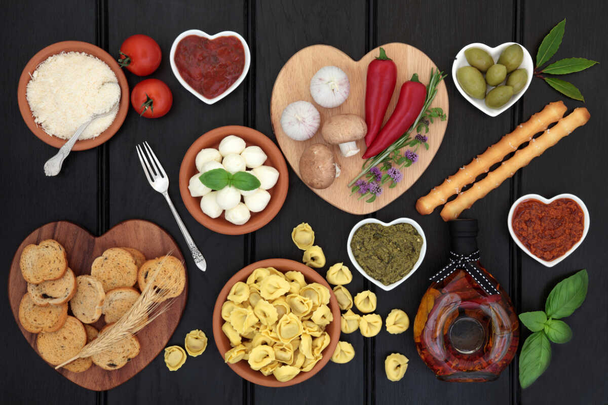 Mediterranean healthy diet food selection over dark wood background.