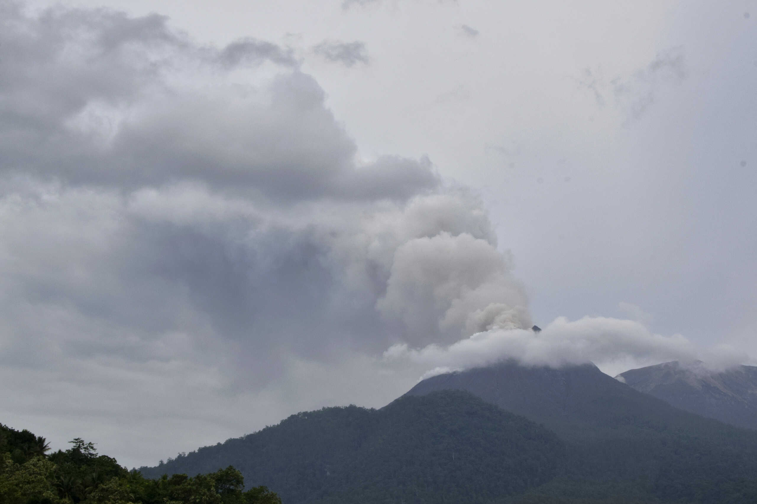 FILE - Mount Lewotobi Laki-Laki spews volcanic materials from its crater during an eruption in East Flores, Indonesia, Sunday, Jan. 14, 2024. (AP Photo