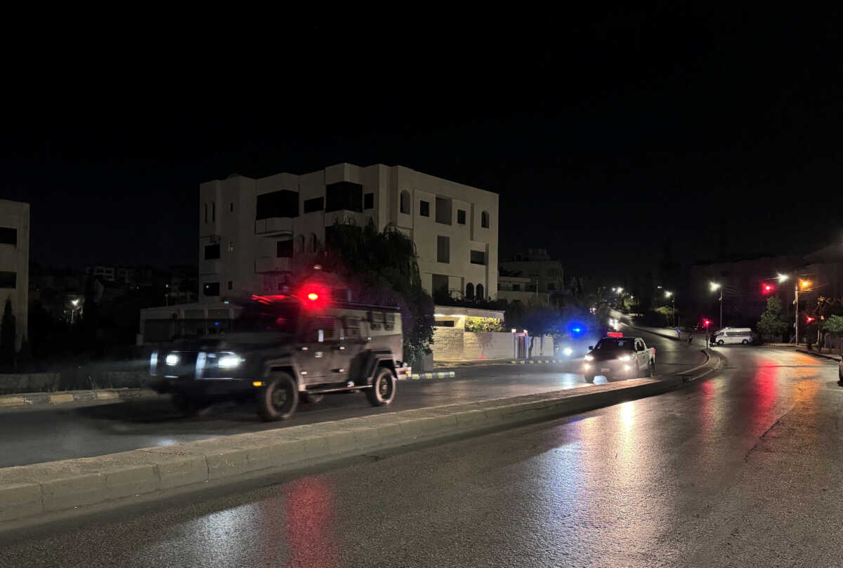 Police vehicles on a street near the Israeli embassy in Amman, Jordan November 24, 2024. REUTERS