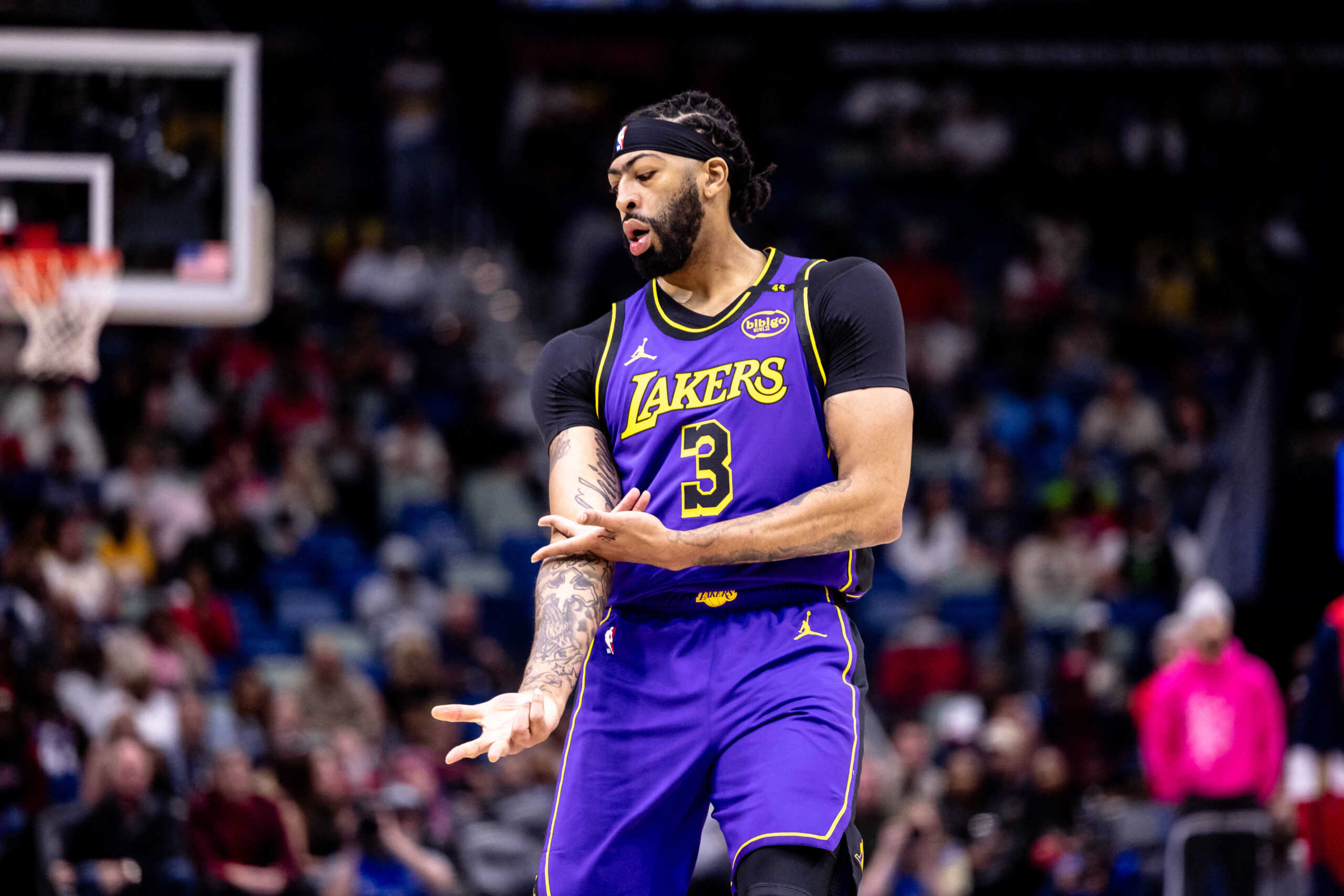 Nov 16, 2024; New Orleans, Louisiana, USA;  Los Angeles Lakers forward Anthony Davis (3) reacts to making a three point basket against the New Orleans Pelicans during the first half at Smoothie King Center. Mandatory Credit: Stephen Lew-Imagn Images