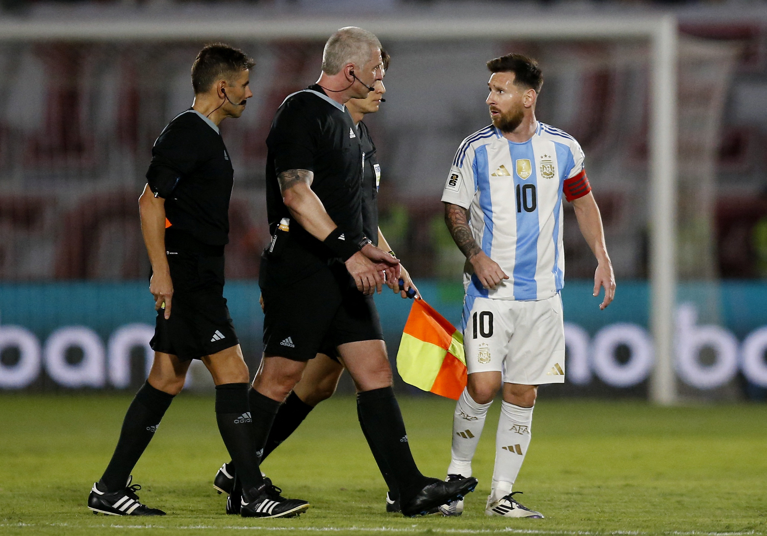 Soccer Football - World Cup - South American Qualifiers - Paraguay v Argentina - Estadio Defensores del Chaco, Asuncion, Paraguay - November 14, 2024 Argentina's Lionel Messi talks to referee Anderson Daronco REUTERS