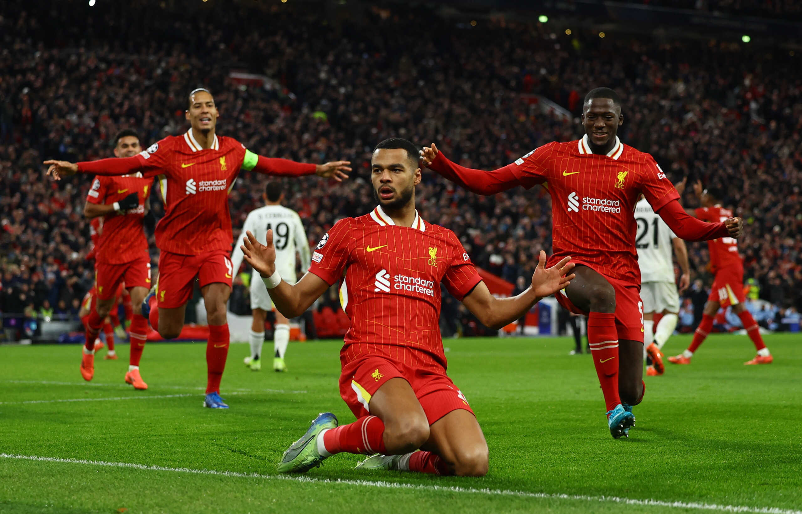 Soccer Football - Champions League - Liverpool v Real Madrid - Anfield, Liverpool, Britain - November 27, 2024 Liverpool's Cody Gakpo celebrates scoring their second goal with Virgil van Dijk and Ibrahima Konate REUTERS