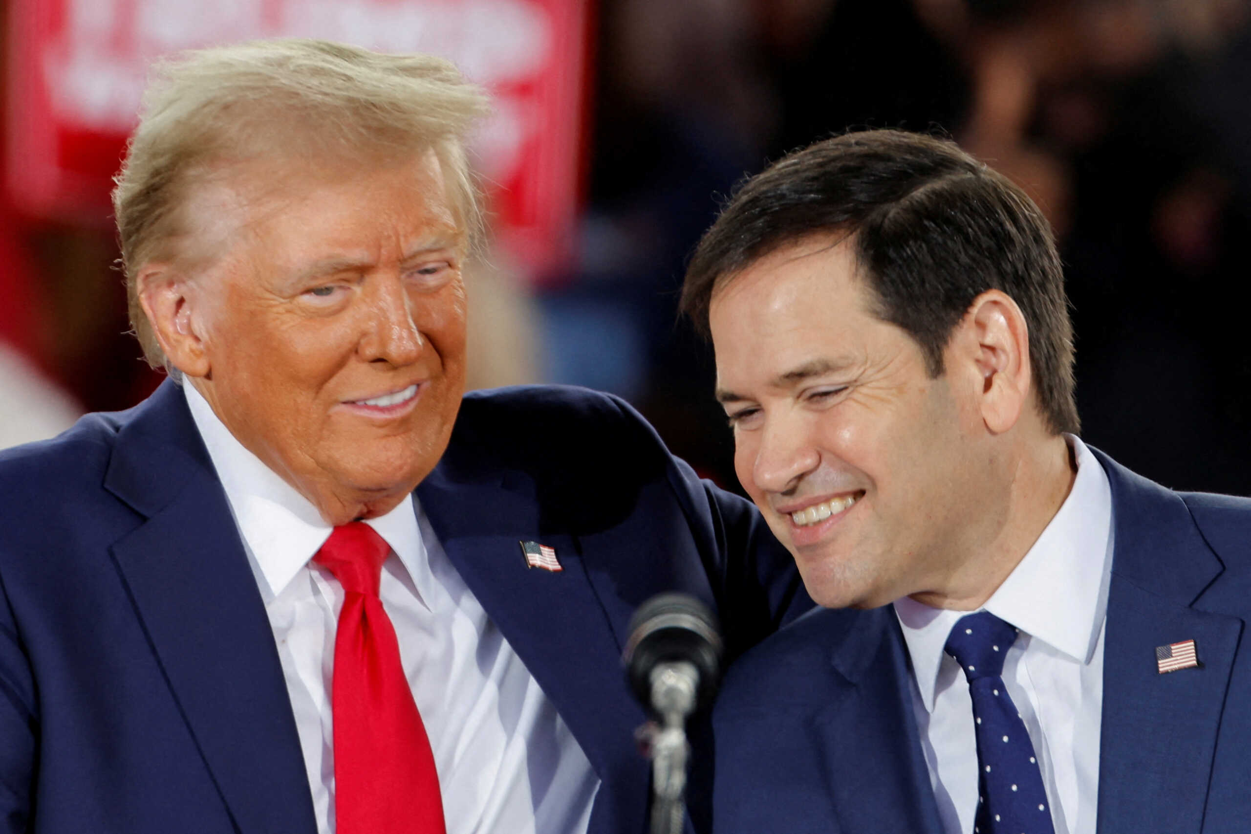Republican presidential nominee and former U.S. President Donald Trump and Senator Marco Rubio (R-FL) react during a campaign event at Dorton Arena, in Raleigh, North Carolina, U.S. November 4, 2024. REUTERS