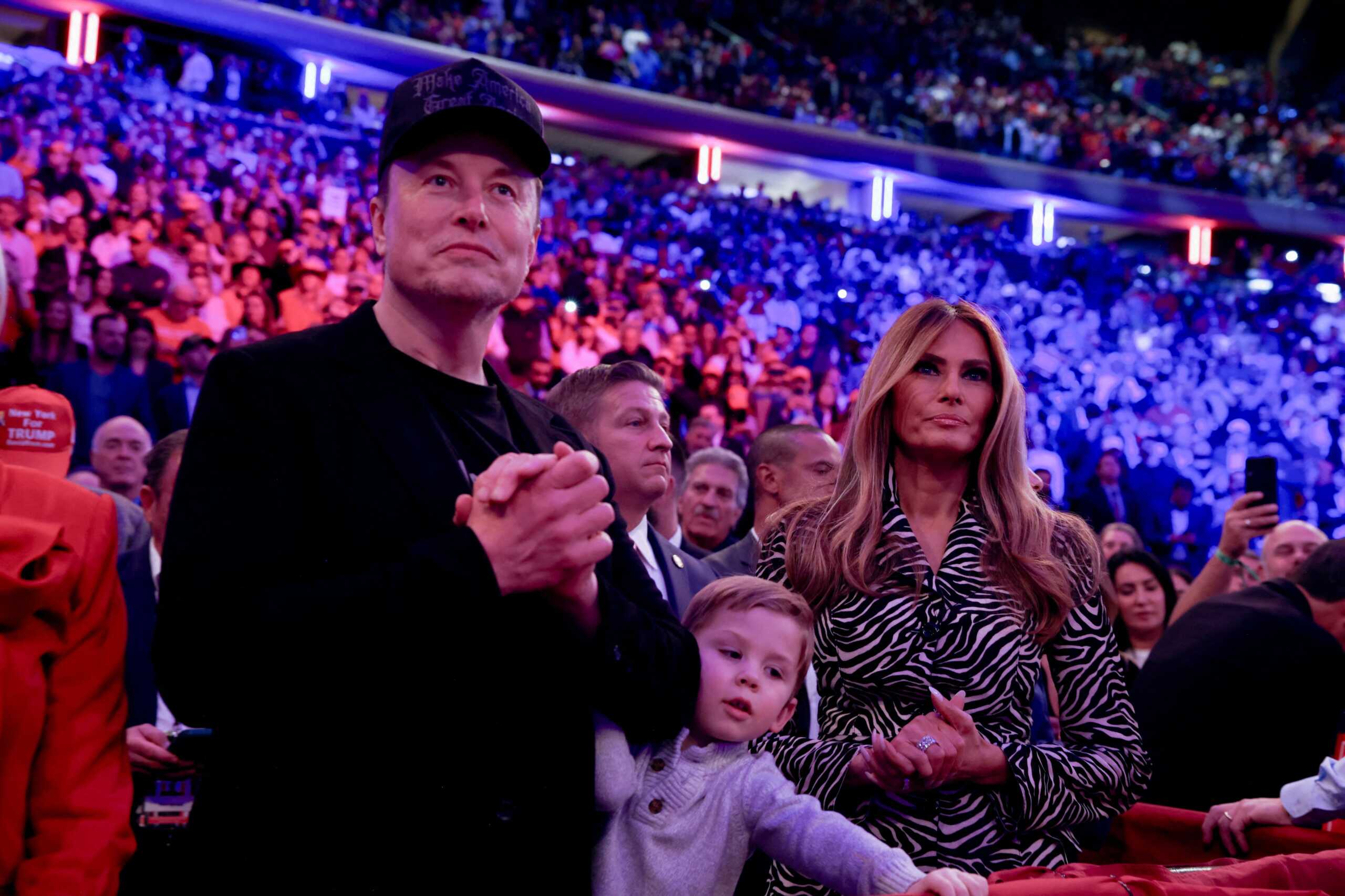 Tesla CEO and X owner Elon Musk and Melania Trump look on during a rally for Republican presidential nominee and former U.S. President Donald Trump at Madison Square Garden, in New York, U.S., October 27, 2024. REUTERS