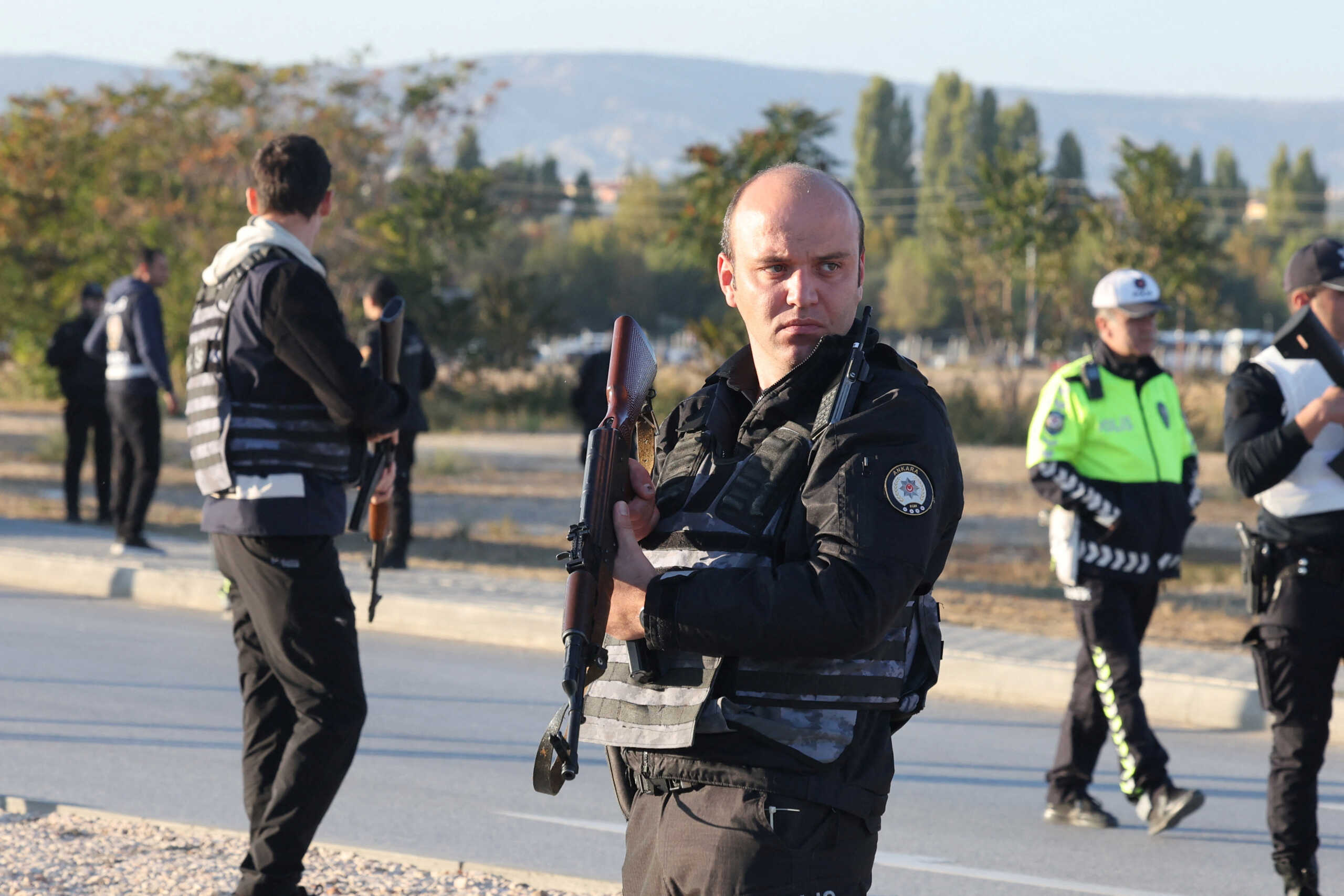 Police and private security guards secure the entrance of the headquarters of Turkey's aviation company TUSAS, where three people were killed and five others wounded in an attack, near Kahramankazan, a town of Turkish capital Ankara, October 23, 2024. REUTERS